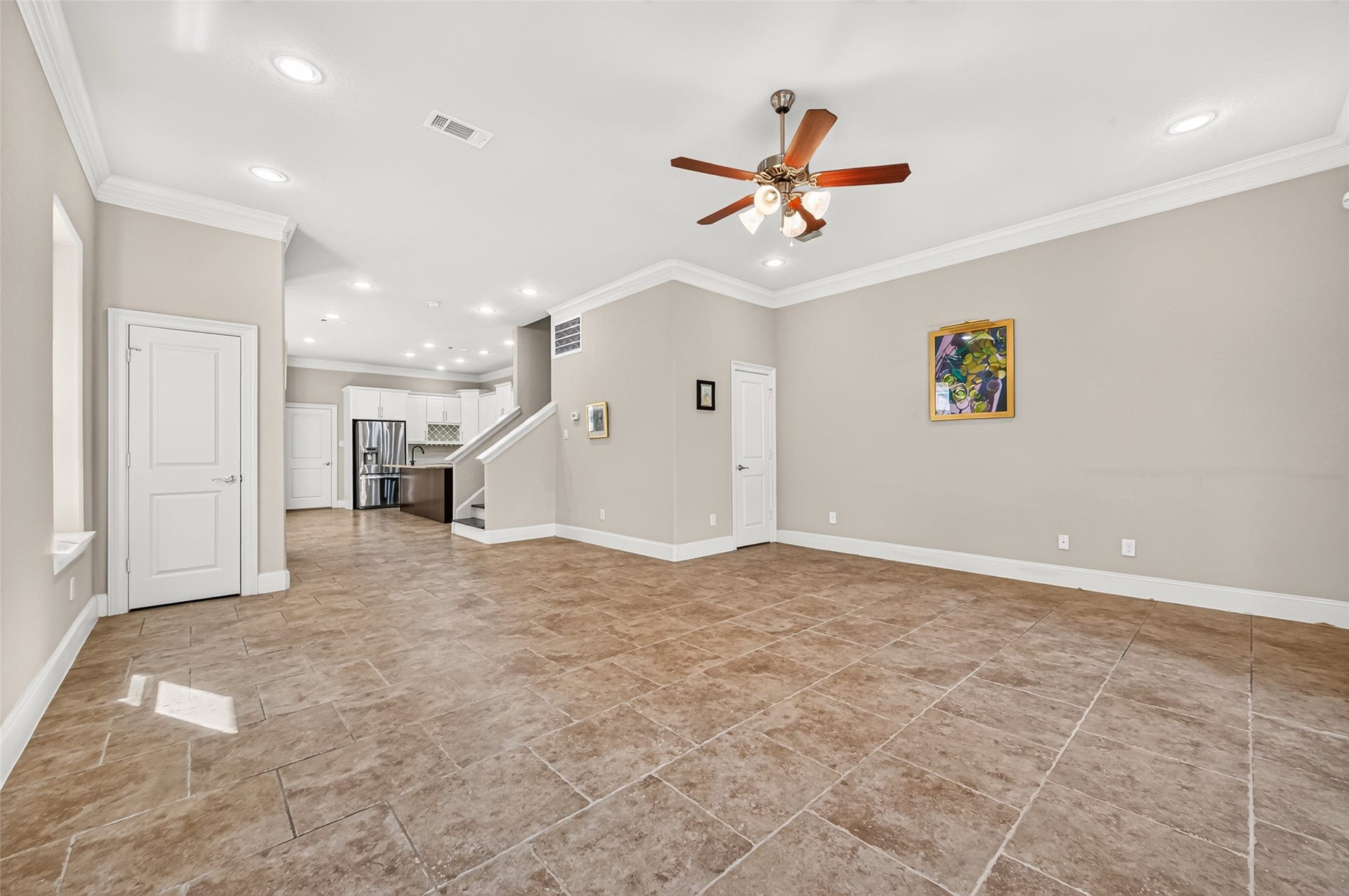 5930 Kiam Street, Houston, TX 77007 Looking back towards open Kitchen Dining area from Living room. Coat closet door on left. Door to right leads to Powder Room/Half Bath (tucked beautifully under the stairs)