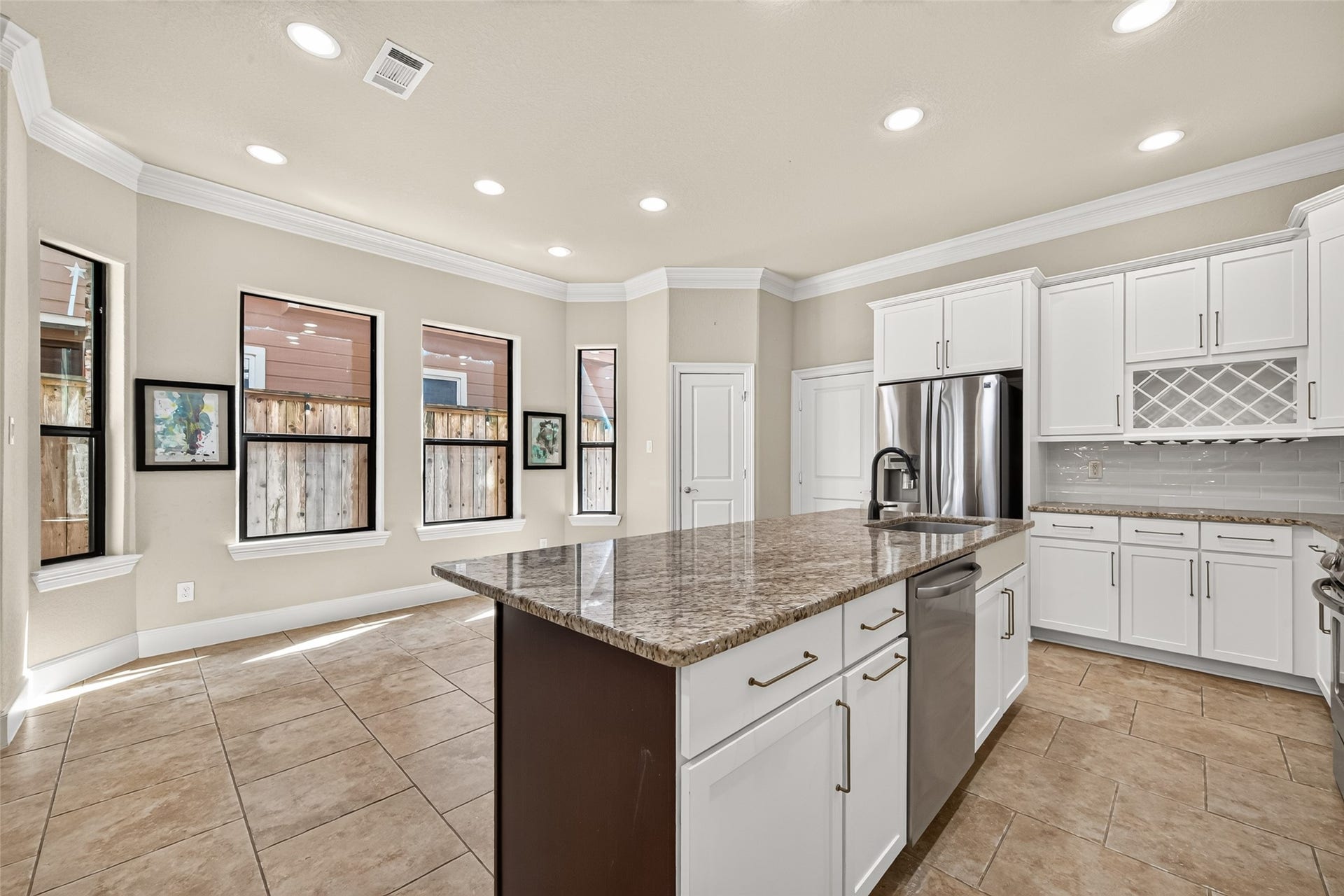 5930 Kiam Street, Houston, TX 77007 Another view from Kitchen overlooking the spacious Breakfasting / Dining Area. Convenient Bar/Bottle and Glass Storage Rack incorporated into Kitchen, next to refrigerator.
