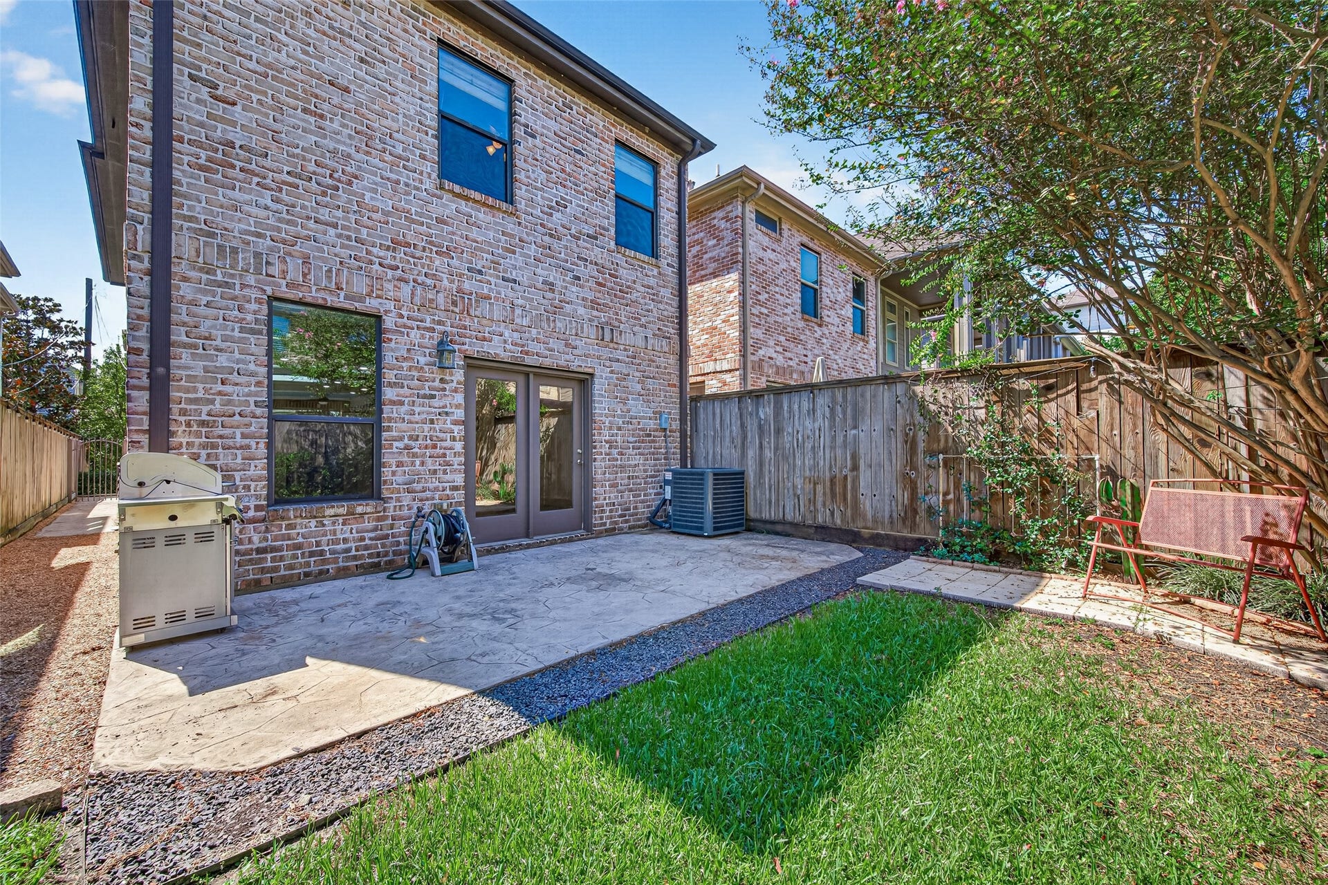 5930 Kiam Street, Houston, TX 77007 Spacious Backyard provides ample room for get togethers & offers lovely shady spaces through hot days! Stamped concrete AND paved patio areas. Fully fenced down to side access gate.