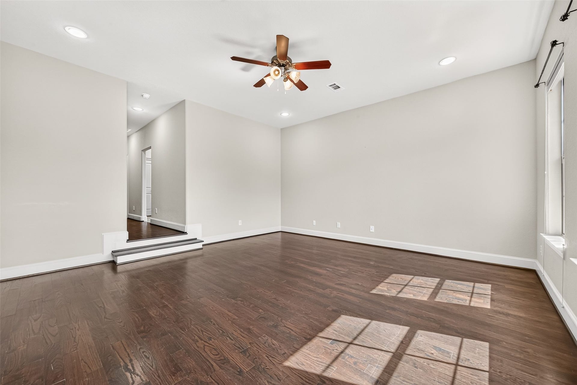 5930 Kiam Street, Houston, TX 77007 From Primary BR Hall, step down into your HUGE Bedroom! This room has it all, privacy, your king bed set AND more, space for work or sitting/reading, tons of daylight, blinds for nighttime, and even rods for curtains if you want.