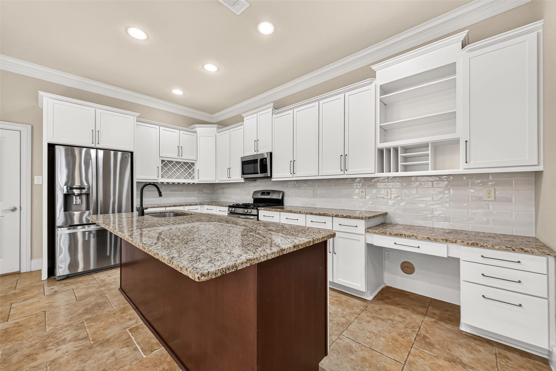 5930 Kiam Street, Houston, TX 77007 Plenty of prep space, Gas Range, Bottle and Glass storage rack far end, plenty shelves, drawers and storage. Space on right provides a separate desk/workspace if desired, equally it extends Kitchen space for use as a Coffee Station or other useful spot.