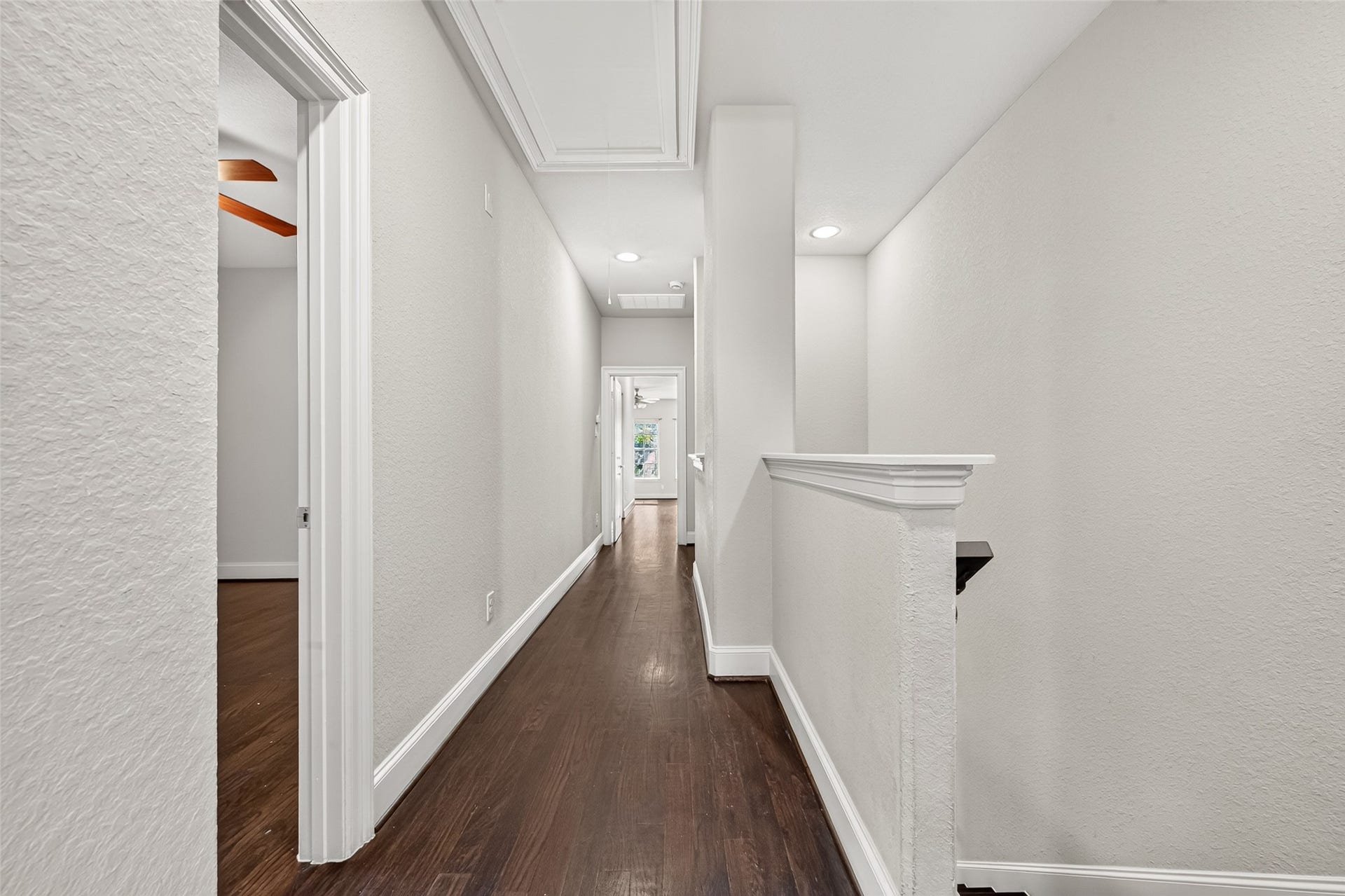 5930 Kiam Street, Houston, TX 77007 2nd Floor features beautiful Hardwoods. Hallway leads to Guest Bedrooms 1&2, Laundry, and Primary Suite (door at end of hall)