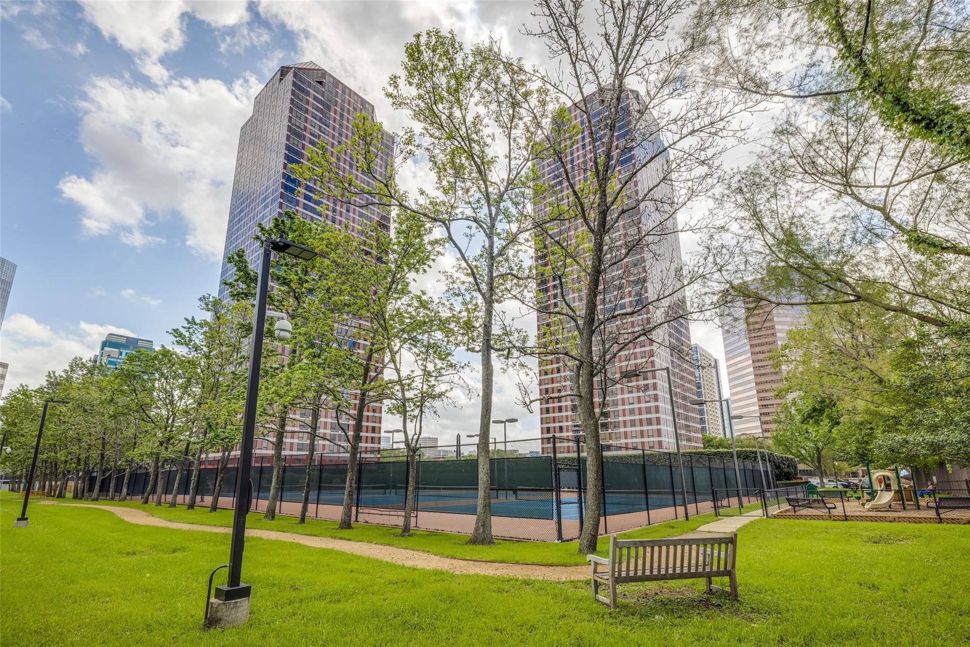 5100 San Felipe Street, #374E, Houston, TX 77056 Full view of the walking trail with a view of the playground.