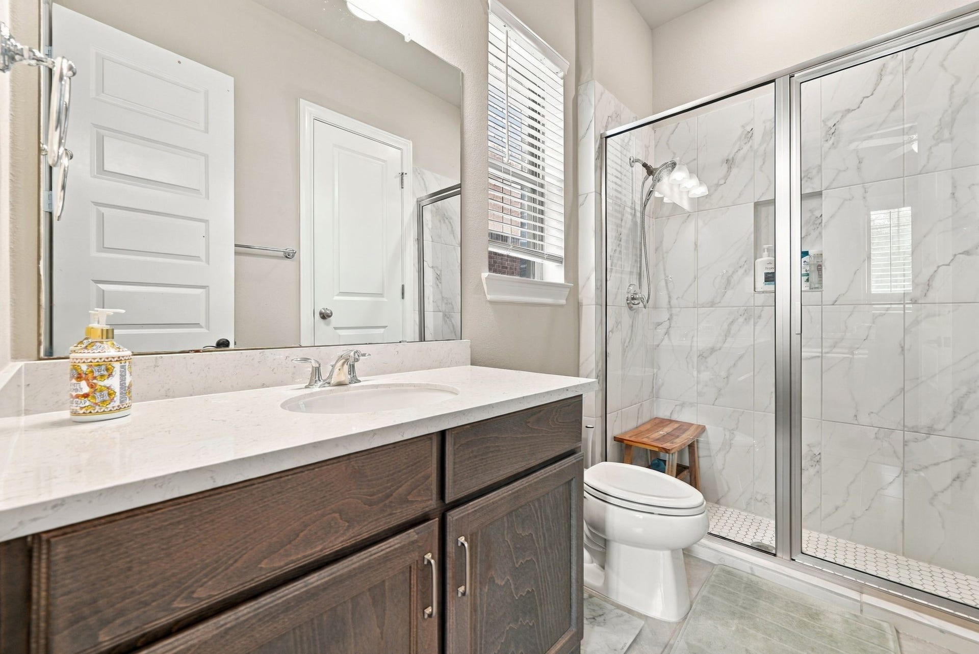 10511 Harvest Oak Court, Missouri City, TX 77459 The full bathroom with a tiled shower.
