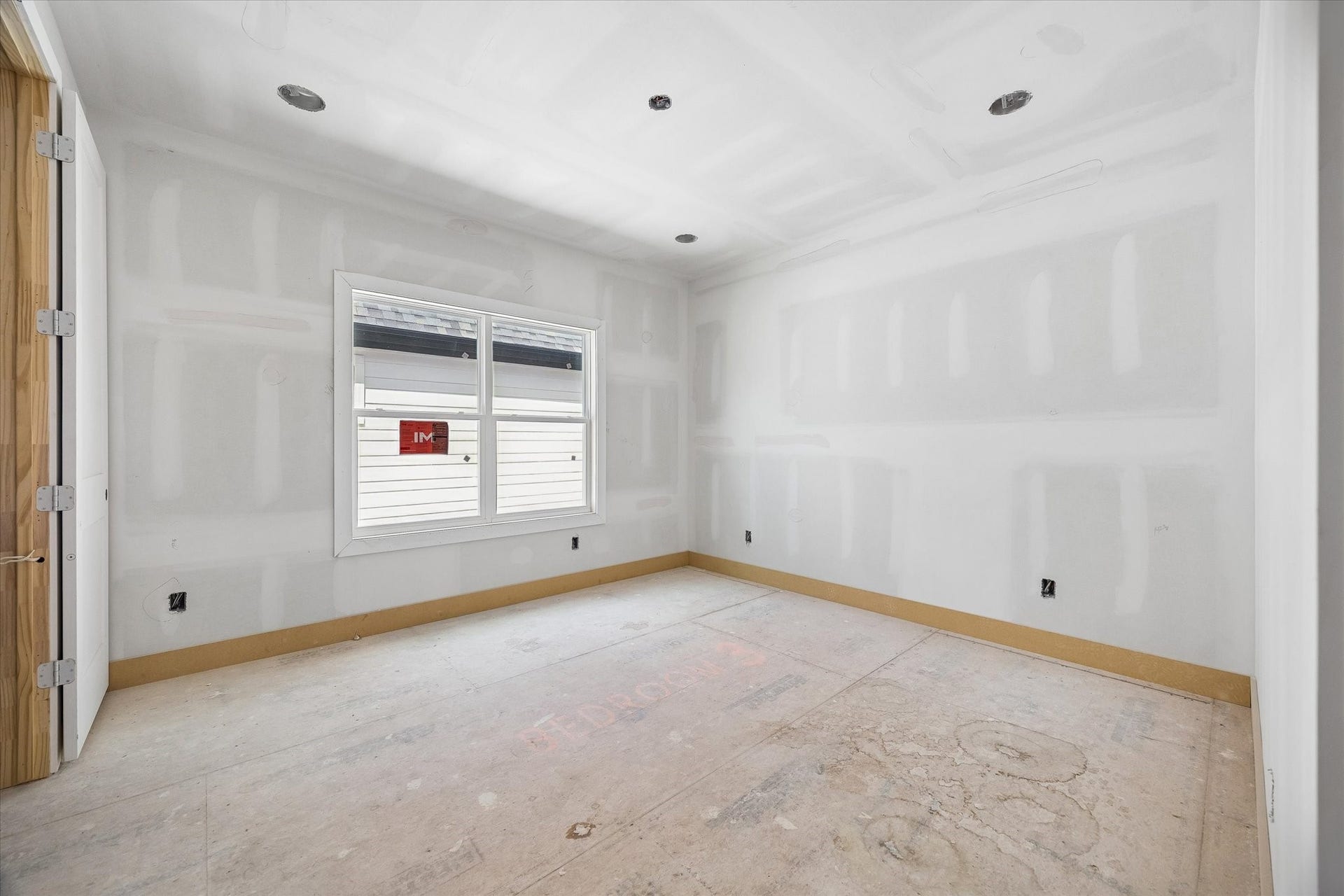Bedroom 3 offers comfortable proportions with a large window bringing in natural light. Its clean, straightforward layout leaves plenty of flexibility for a guest room, secondary bedroom or home office. **Current Construction as of 9/11/26