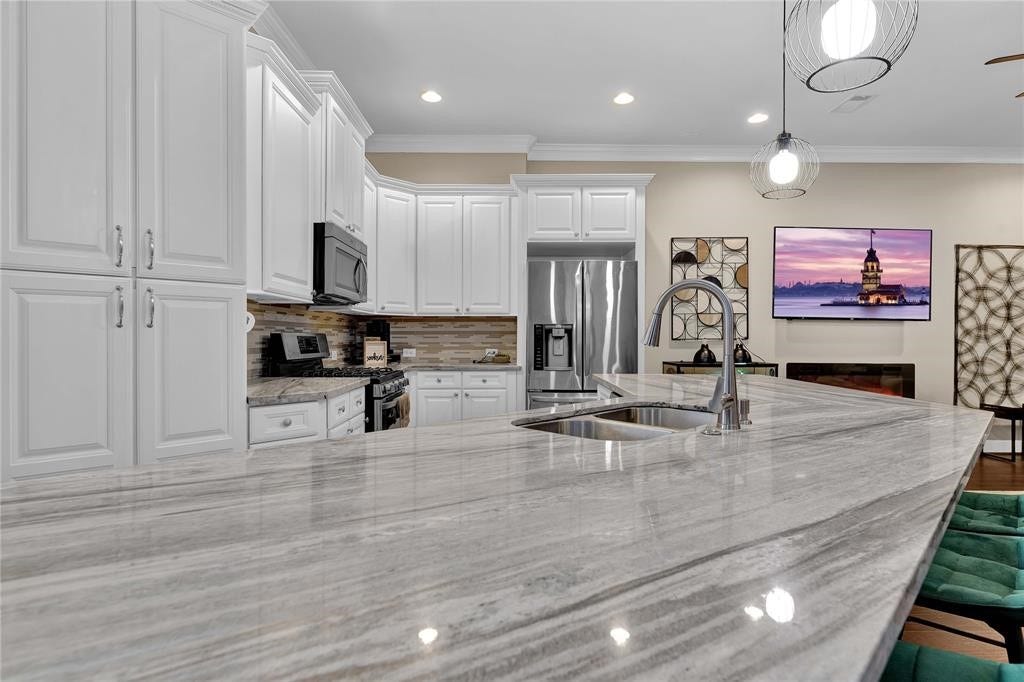 14502 San Pietro Drive, Houston, TX 77070 Ample white cabinetry with granite countertops!