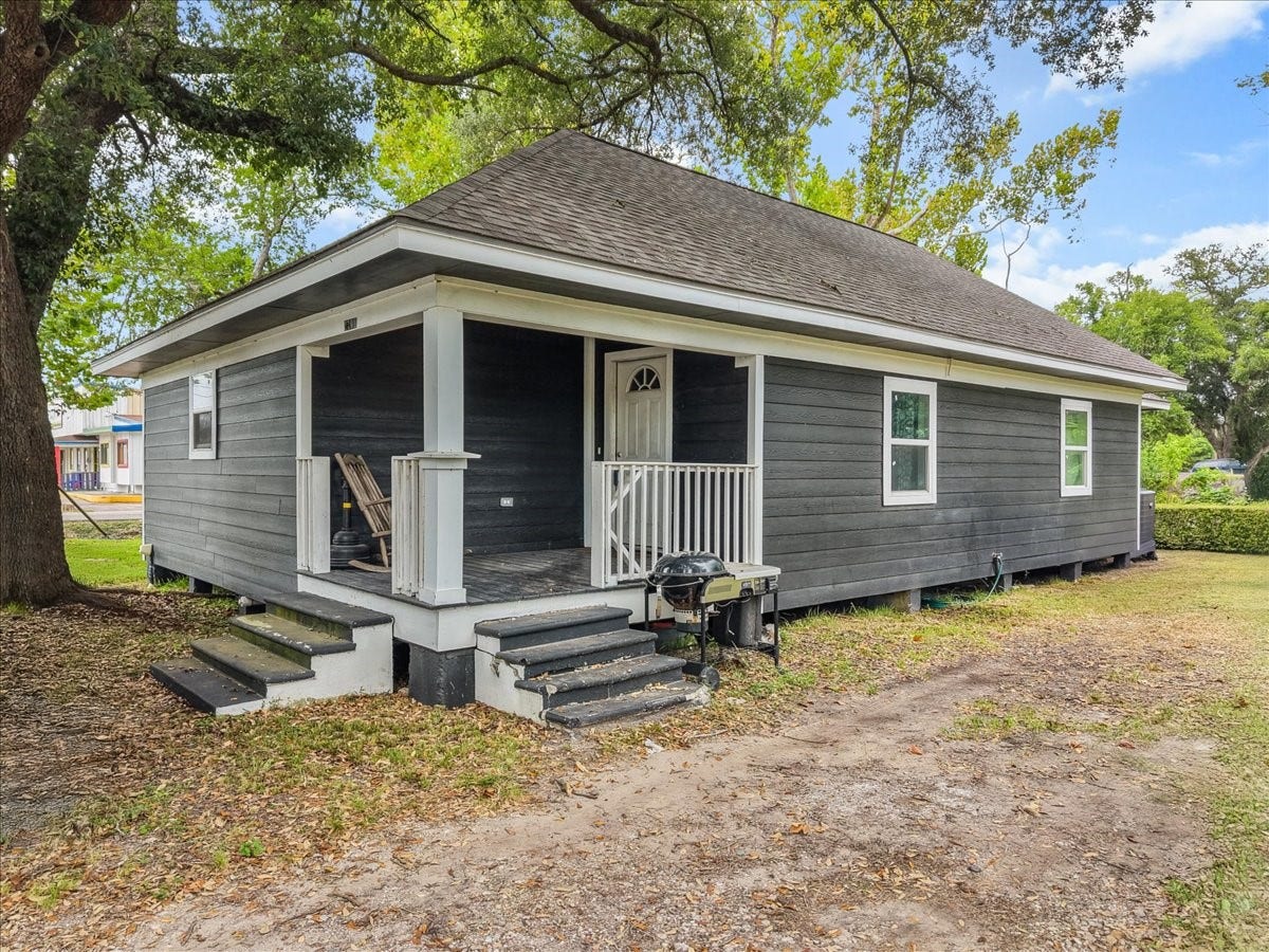 5201 Main Street, Santa Fe, TX 77510 Enjoy the charm of this renovated ranch-style home, complete with two porches that offer inviting spots to relax and enjoy the outdoors. The spacious corner lot and mature trees add to the home's character and appeal.