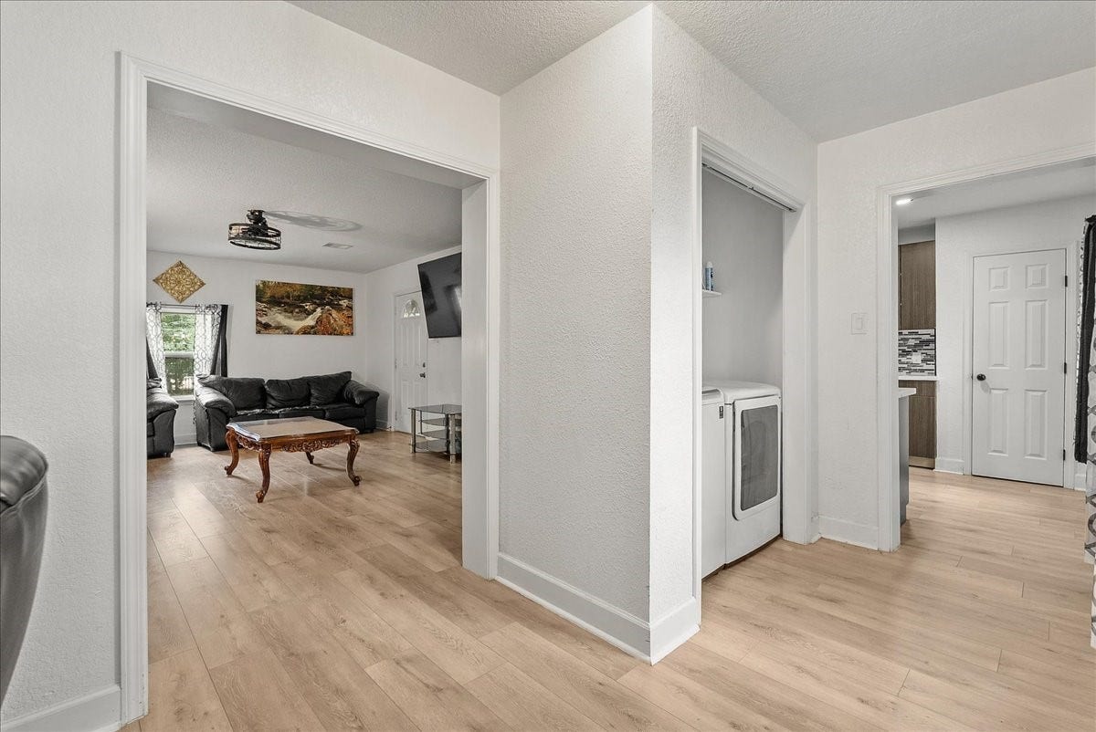 5201 Main Street, Santa Fe, TX 77510 Whether you need a dedicated dining space or a spot to work from home, this open area offers flexibility while keeping the indoor laundry area conveniently out of the way.
