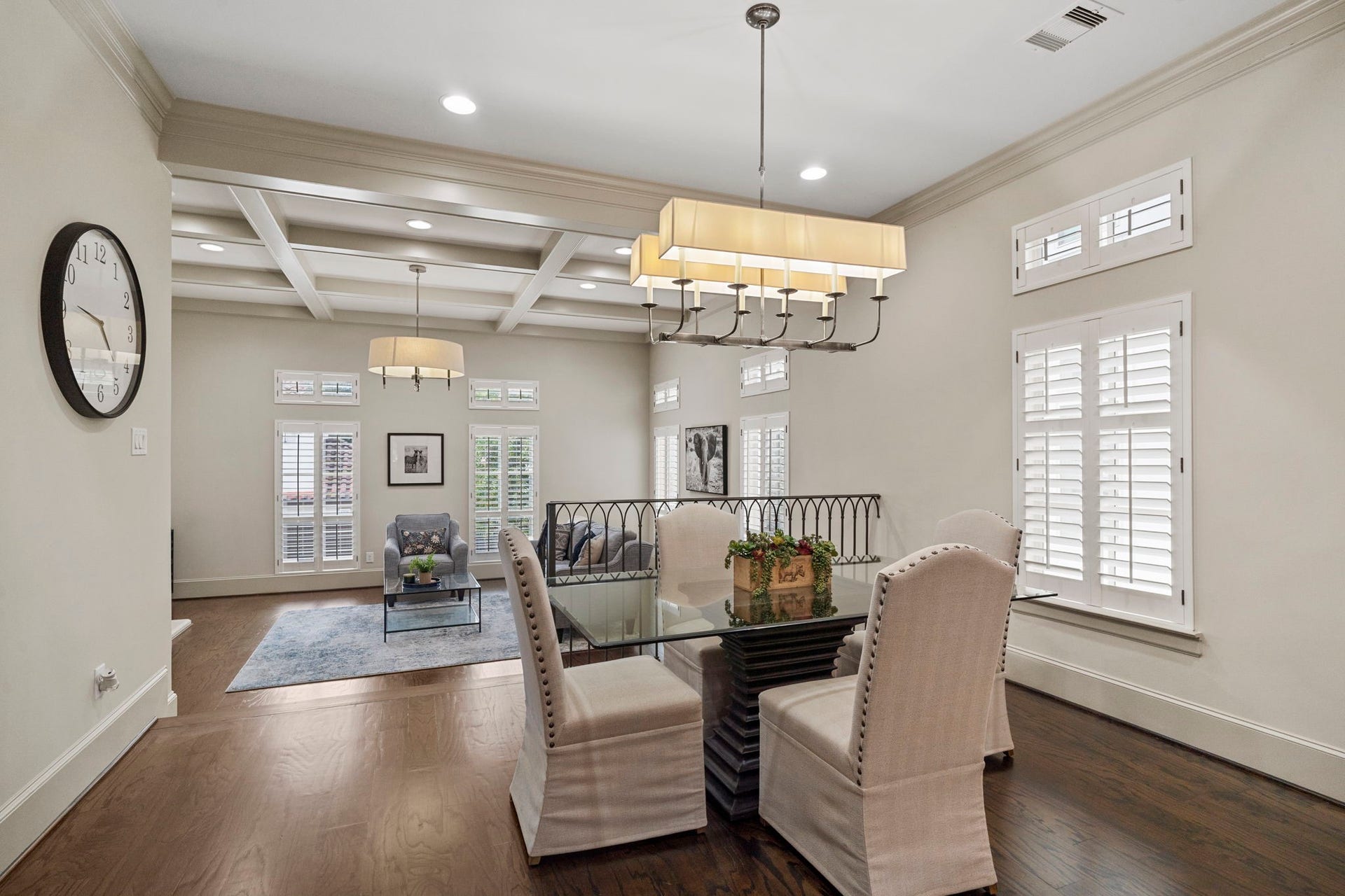 15931 Morgan Street, Sugar Land, TX 77478 Designer Chapman & Myers Linear 10-Light Chandelier makes a bold statement in the dining room.
