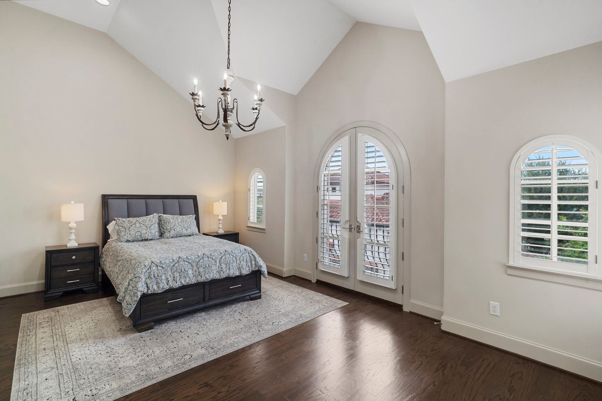 15931 Morgan Street, Sugar Land, TX 77478 Arched French doors, accented by two arched windows, bring an old-world elegance to the owners suite.