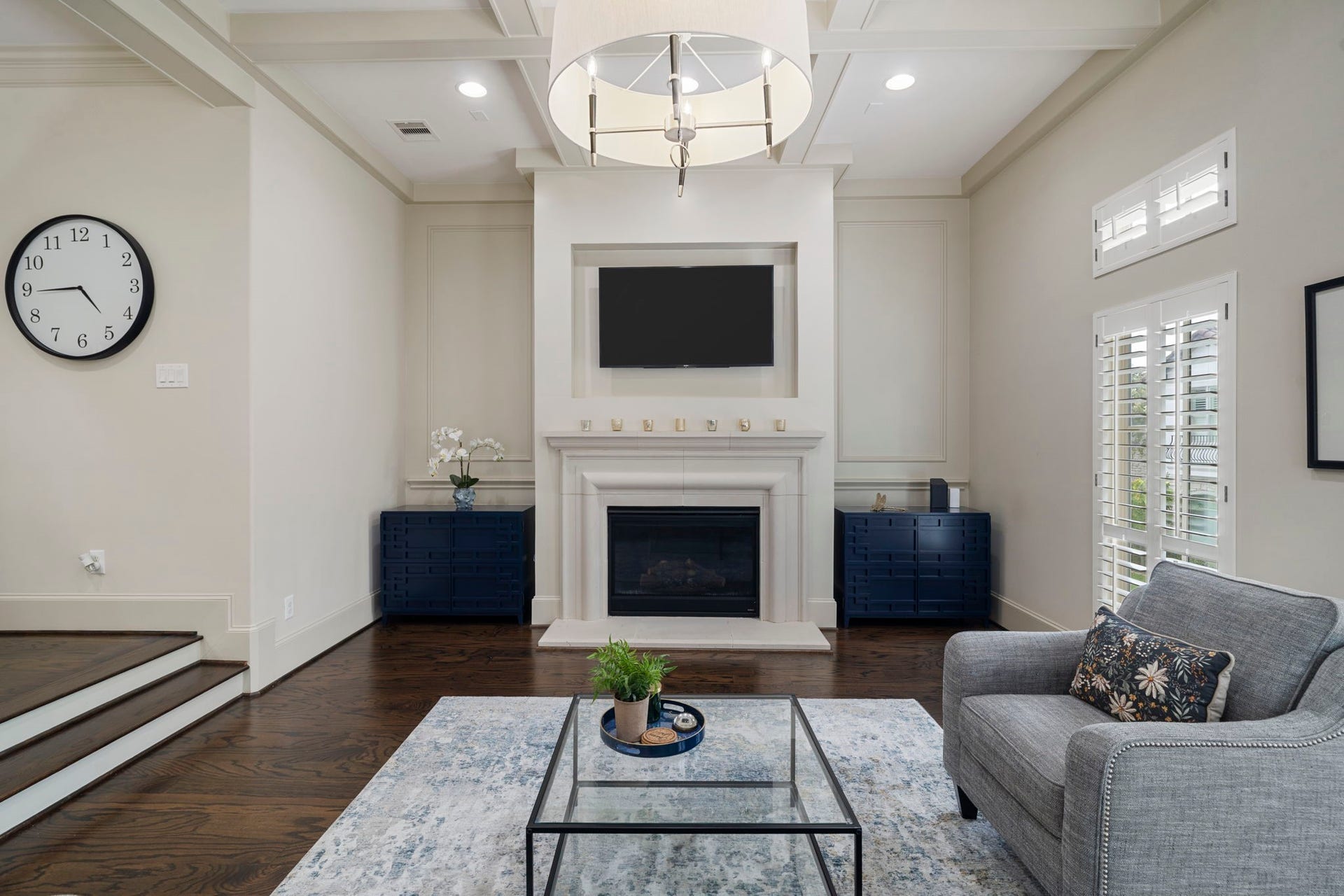 15931 Morgan Street, Sugar Land, TX 77478 Timeless cast stone gas-log fireplace with remote start serves as the living rooms elegant focal point.
