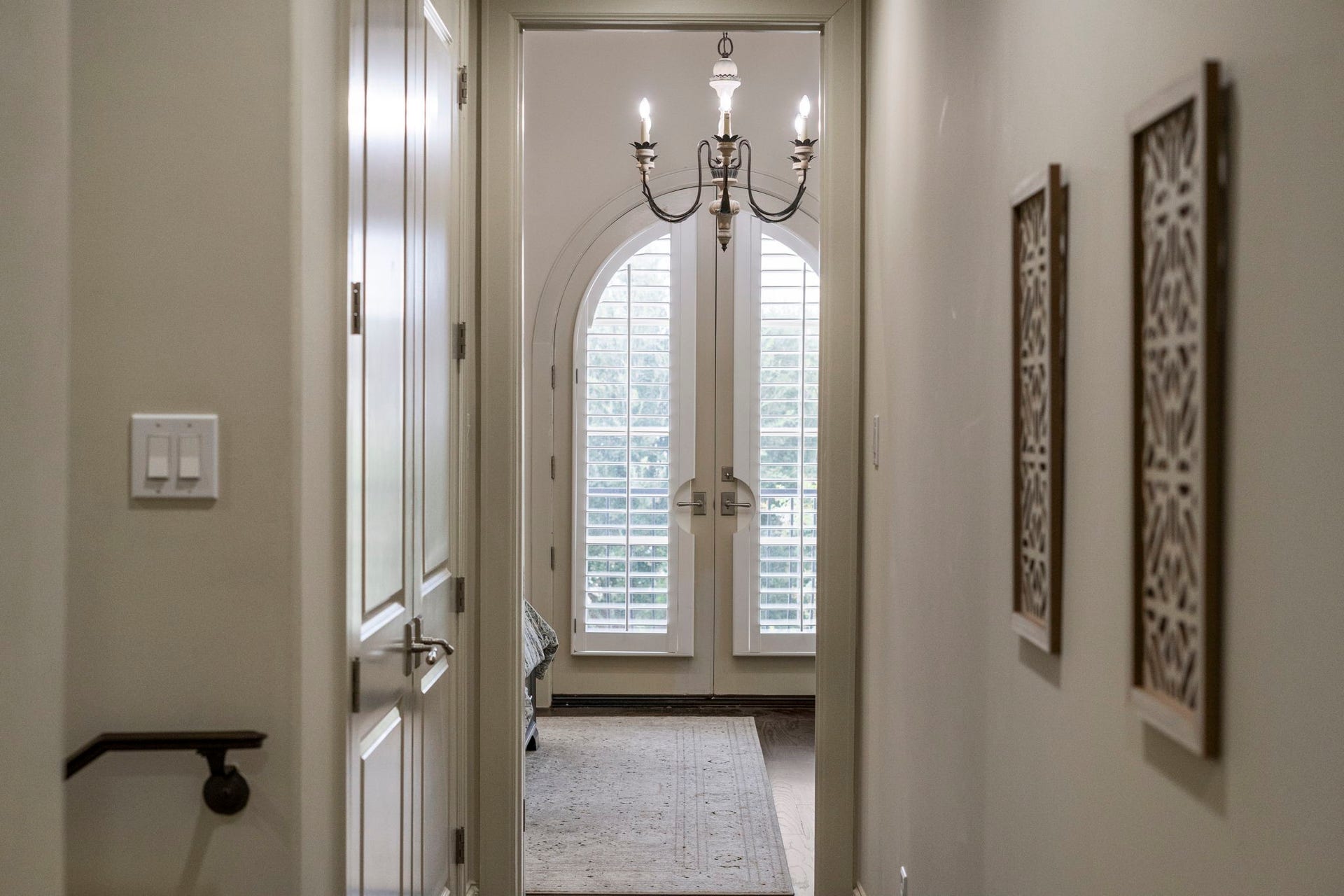 15931 Morgan Street, Sugar Land, TX 77478 Gracefully framed, the view toward the owner's suite highlights the homes upscale ambiance and beautifully appointed finishes.
