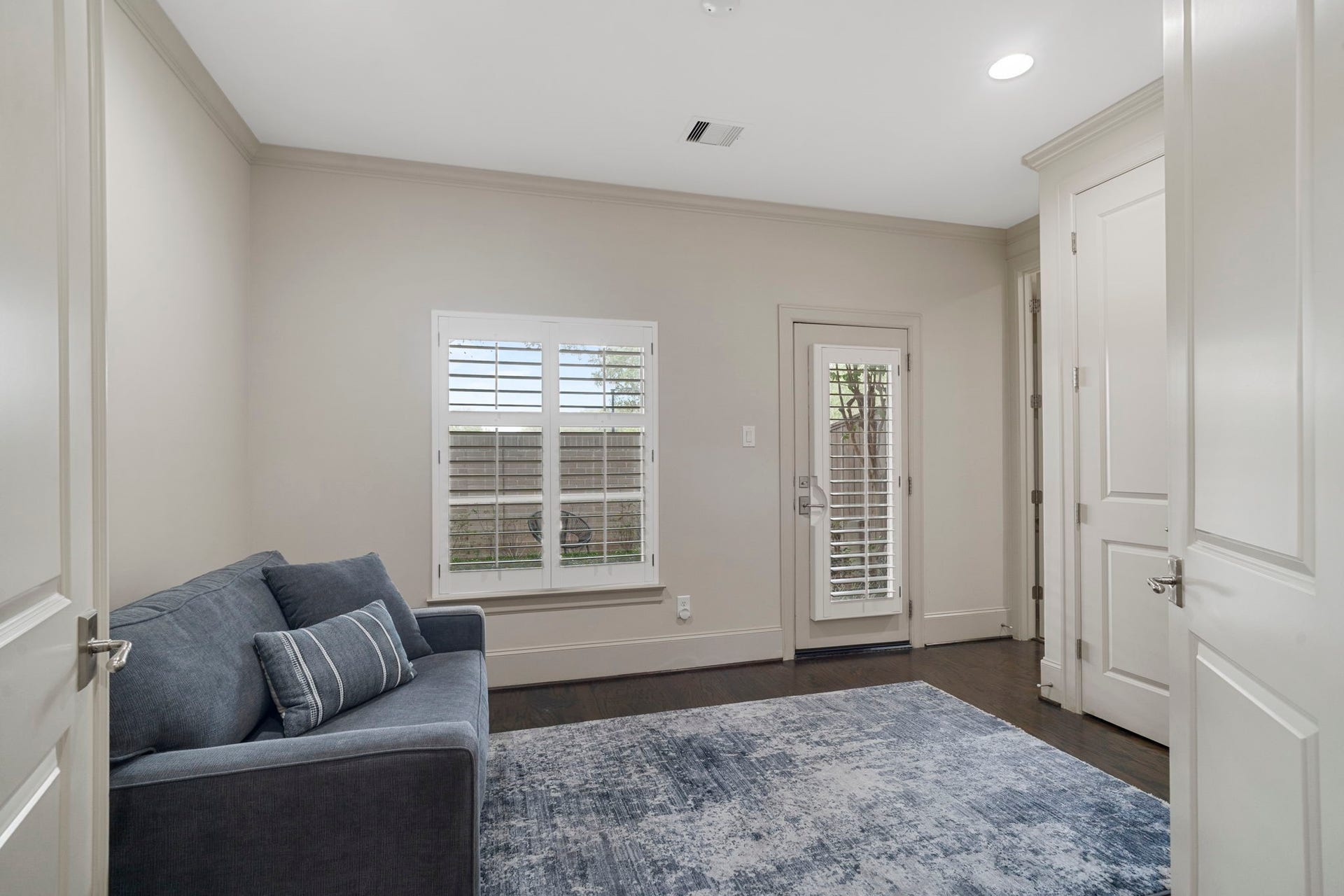 15931 Morgan Street, Sugar Land, TX 77478 Double doors open to the first floor bedroom with en suite bath and patio access.