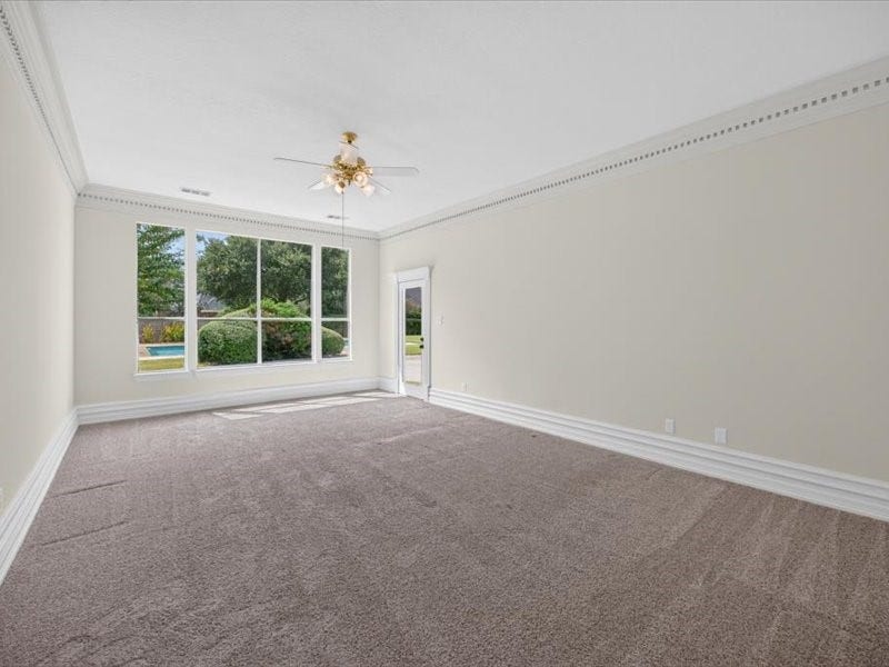 32719 Weybridge Street, Fulshear, TX 77441 The primary bedroom located on the left side of the home is HUGE! There is enough space for a sitting area and have plenty of room for all your bedroom furniture. You will also appreciate the view into the backyard.
