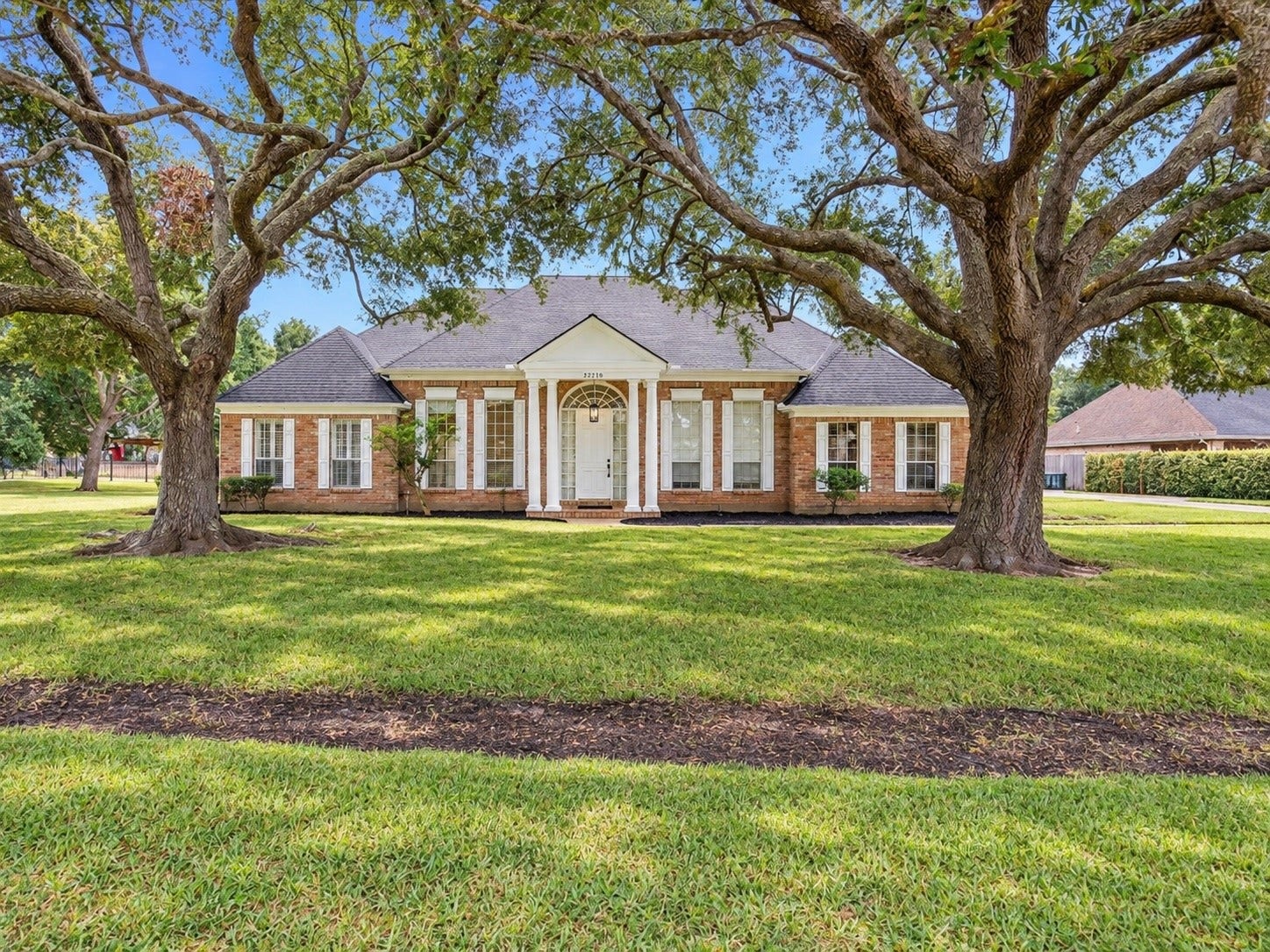 32719 Weybridge Street, Fulshear, TX 77441 You will love the mature trees that flank this beautiful home.