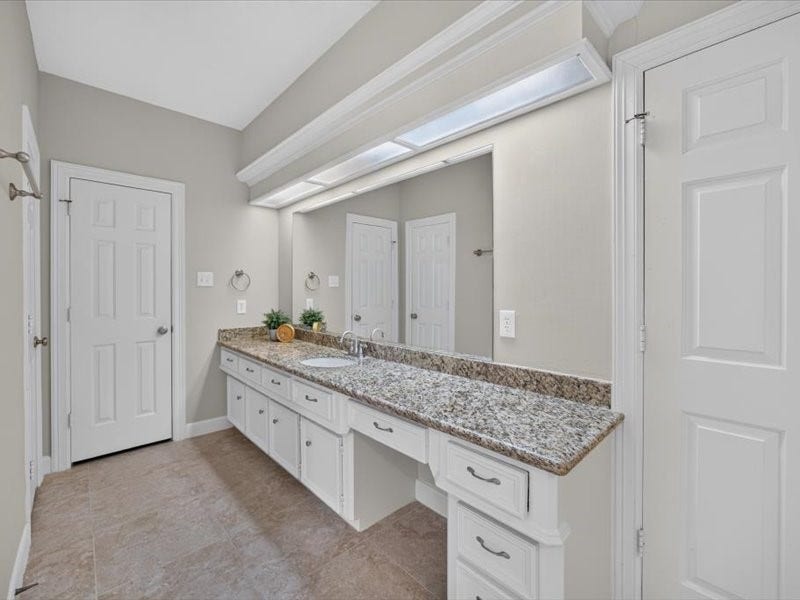 32719 Weybridge Street, Fulshear, TX 77441 The extra long counter gives you space for all your bathroom essentials. You will also have a vanity.