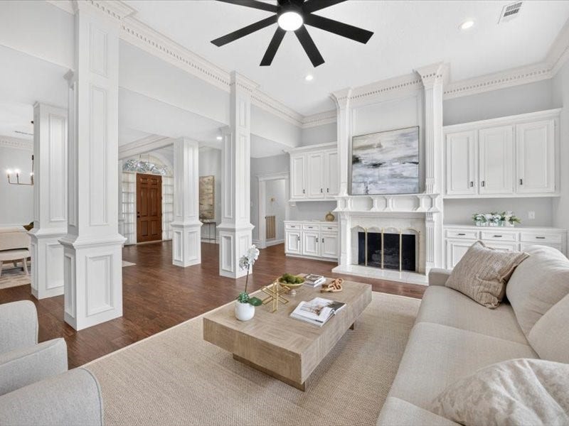 32719 Weybridge Street, Fulshear, TX 77441 Architectural details such as columns and molding make this home memorable. You will love the built-ins that flank the beautiful fireplace.