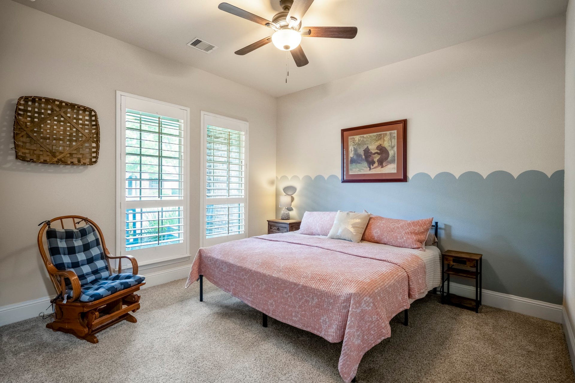 The first of two secondary bedrooms with beautiful windows and blinds.