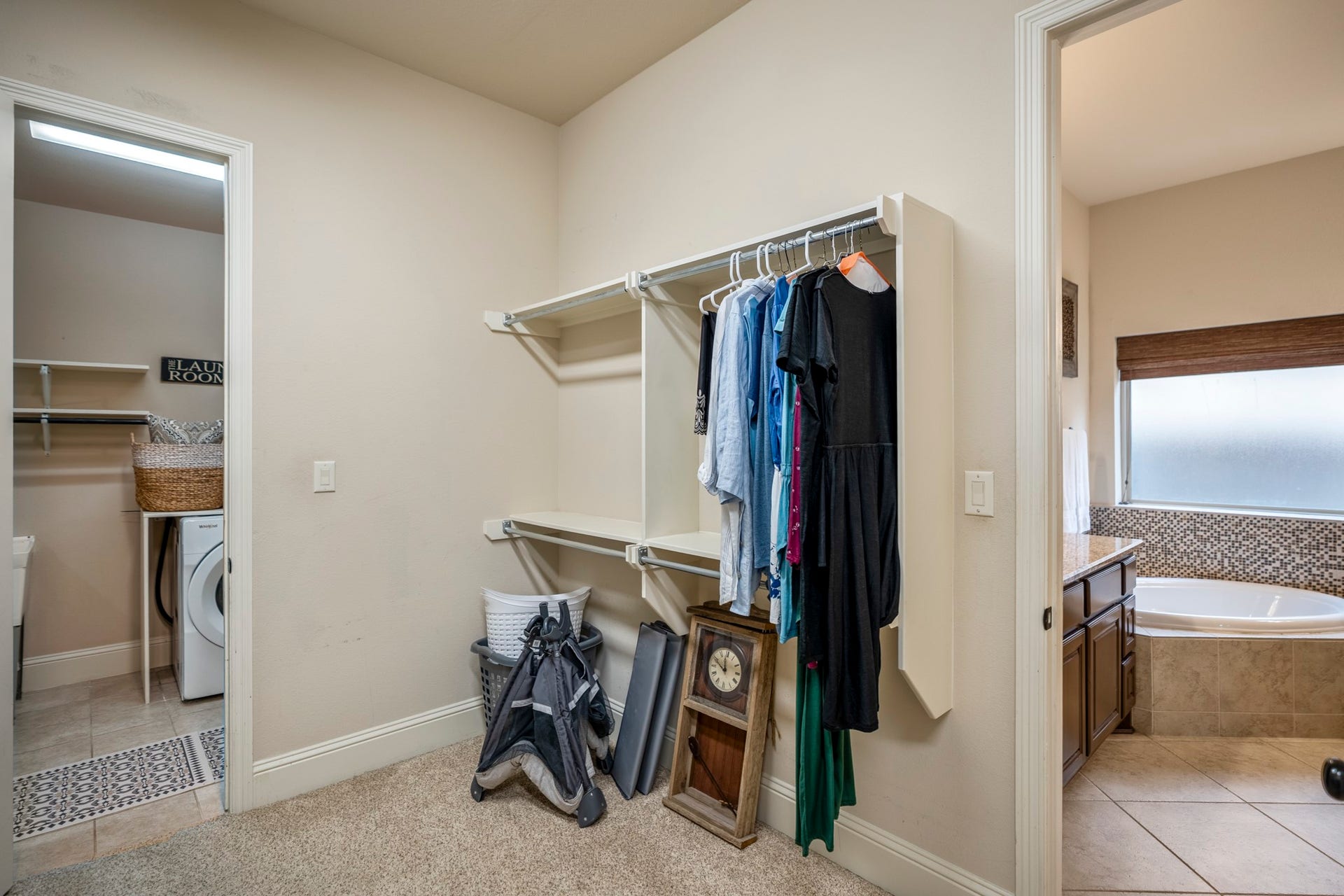 The laundry room is conveniently located right off the closet.