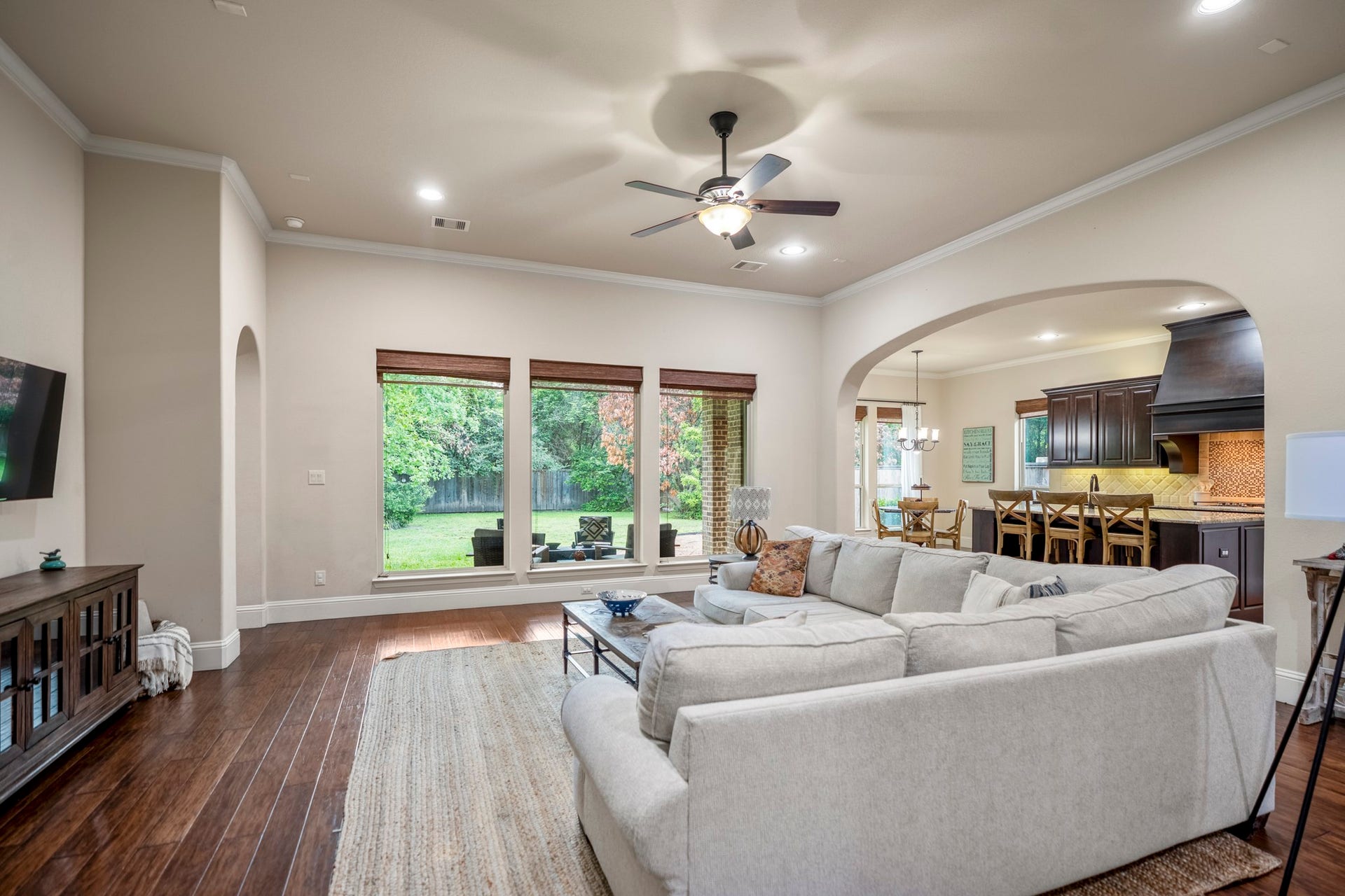A cozy and comfortable living room with backyard views makes everyday living something to enjoy.