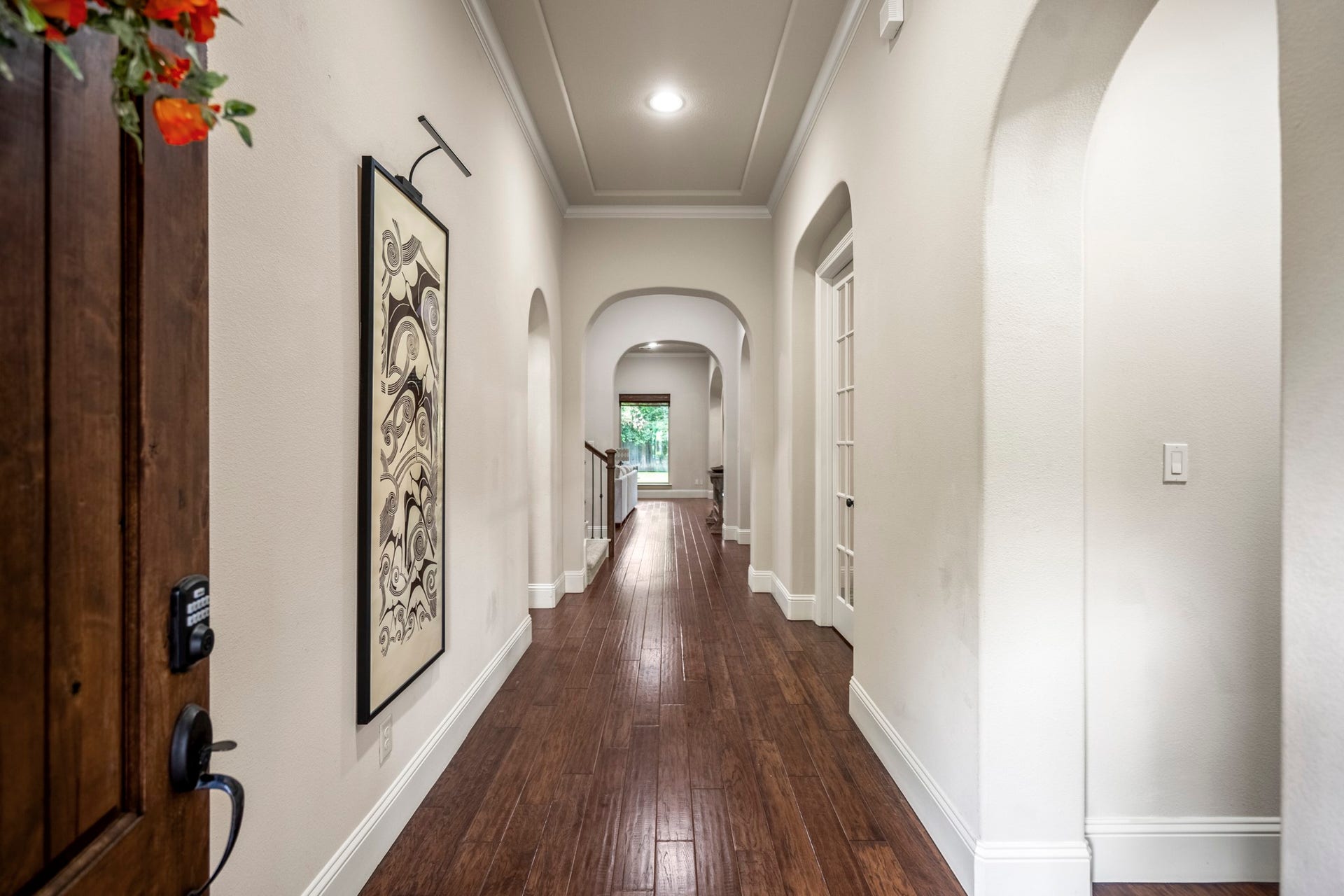Wood floors add warmth and elegance throughout the main living spaces.