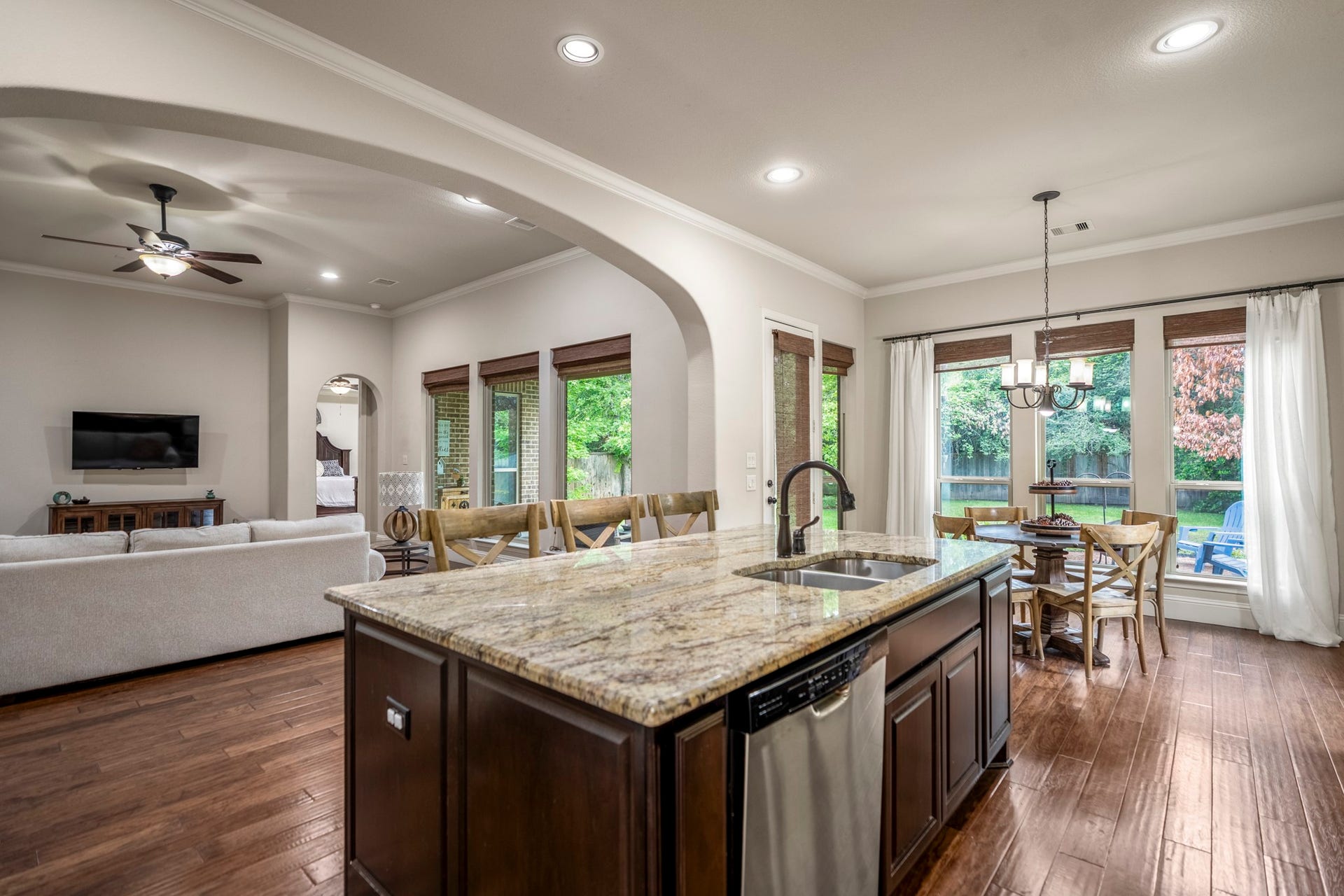 The gourmet kitchen boasts a large island with seating and storage.