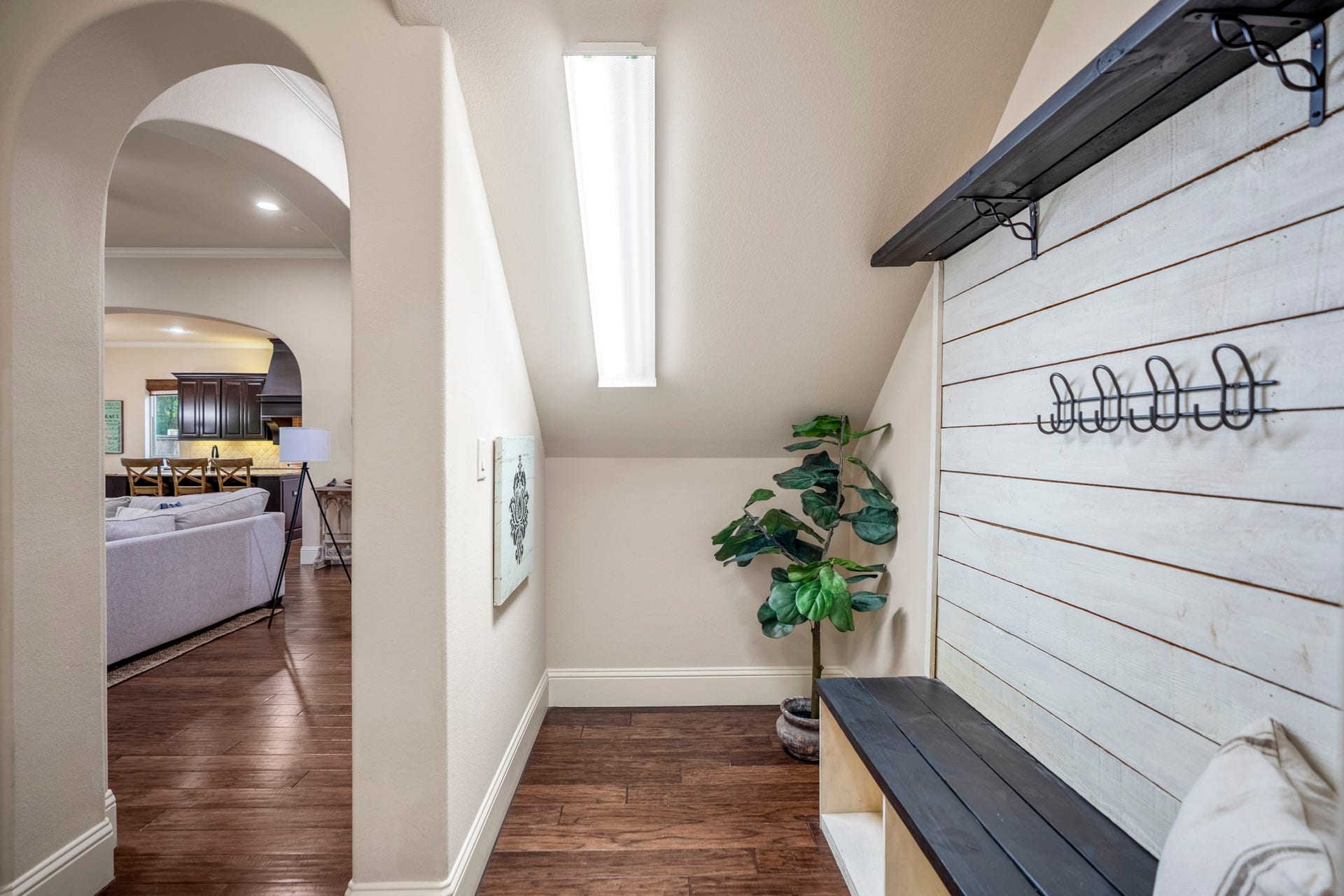 Backpacks, shoes, coats, and extra storage are gathered here, away from the main living space.