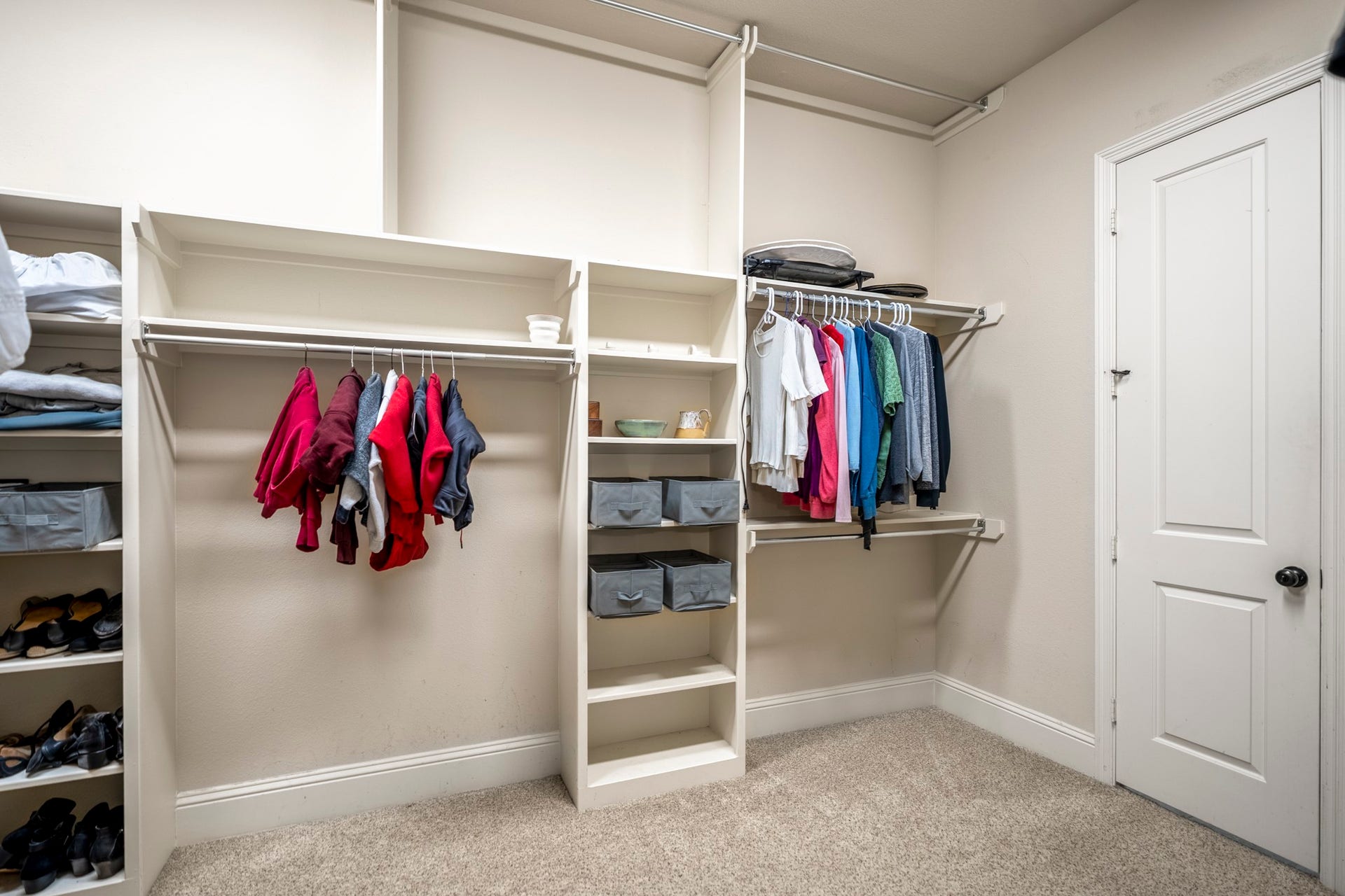 The primary closet is a floor to ceiling organization dream.