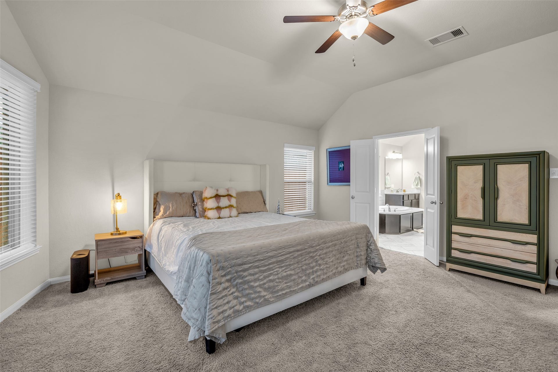 Plenty of room for a king bed and sitting area, with direct access to the primary bath.