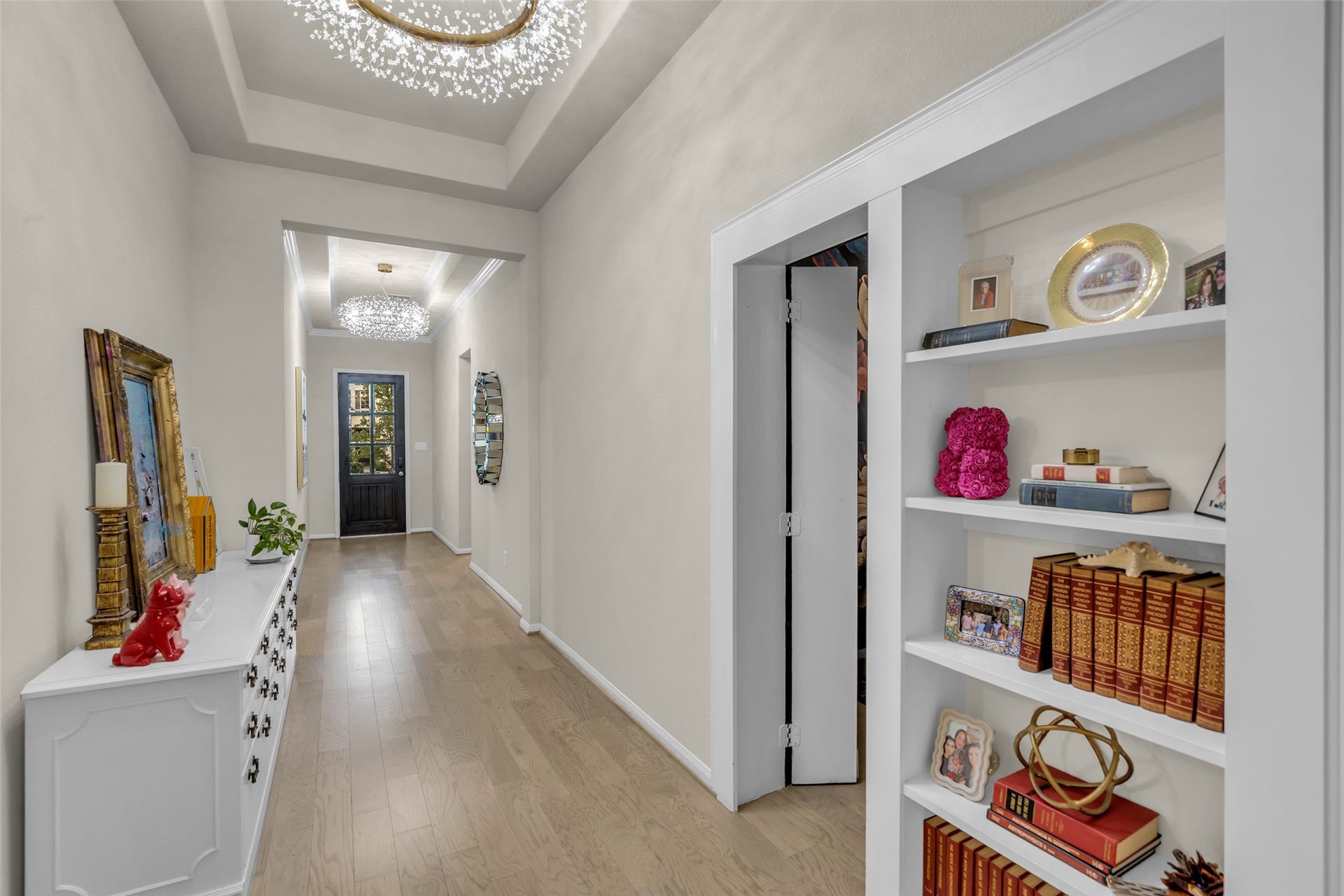A hidden bookshelf entrance reveals a dramatic, one-of-a-kind speakeasy designed for unforgettable entertaining.