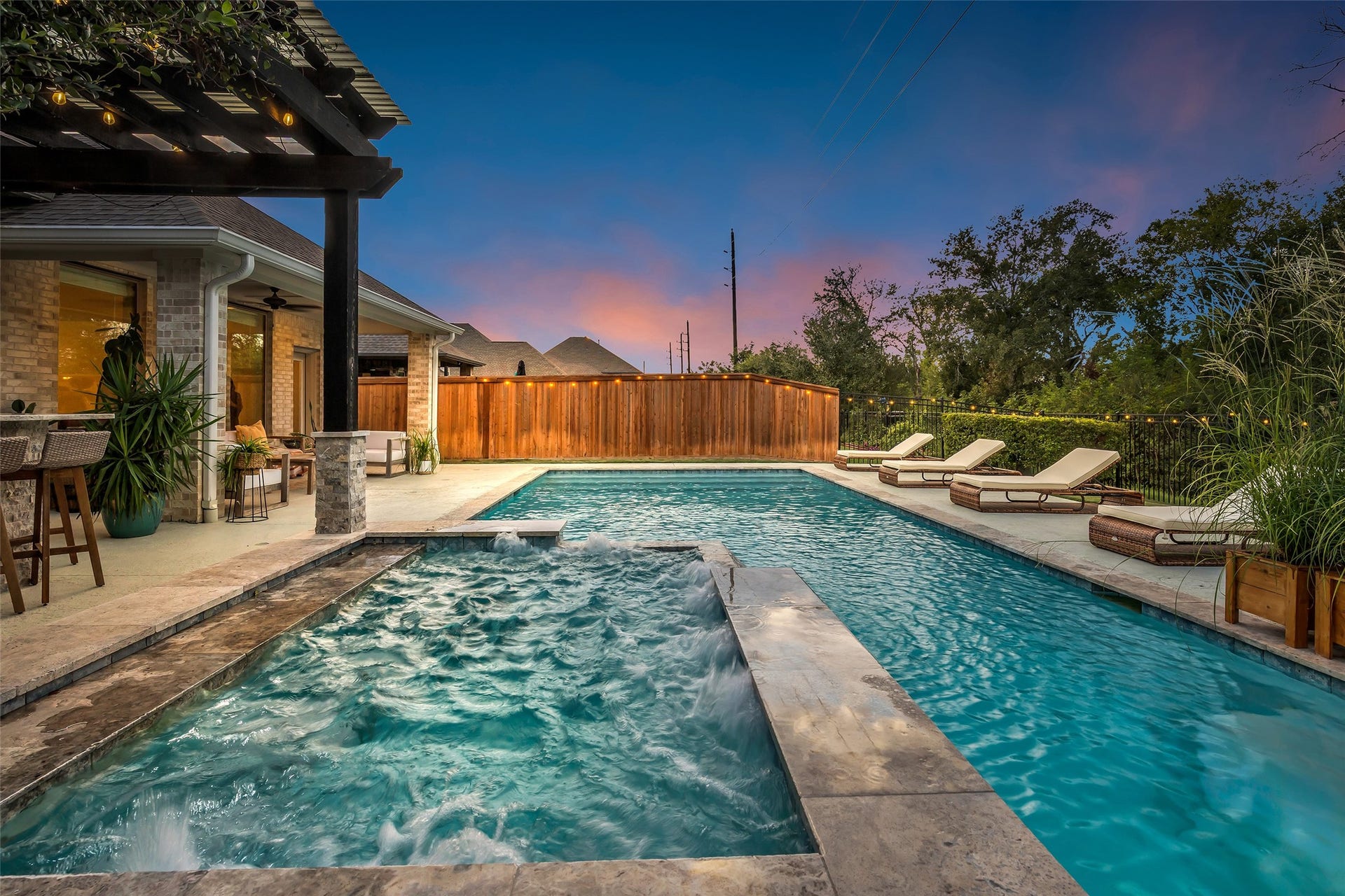 Soak in the spa as it spills over into the pool.