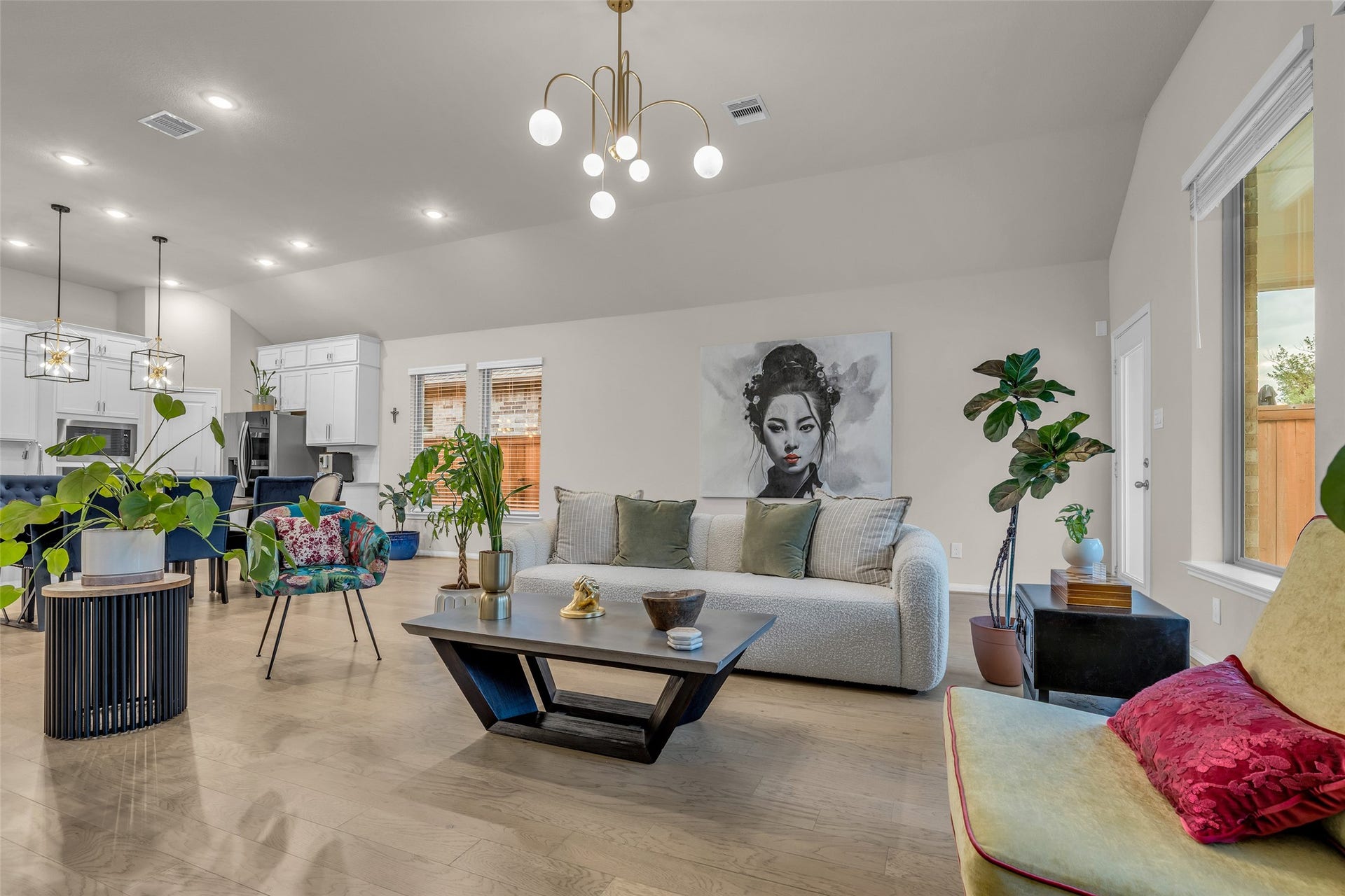 Open sightlines from the living room to the kitchen and dining area keep everyone connected.