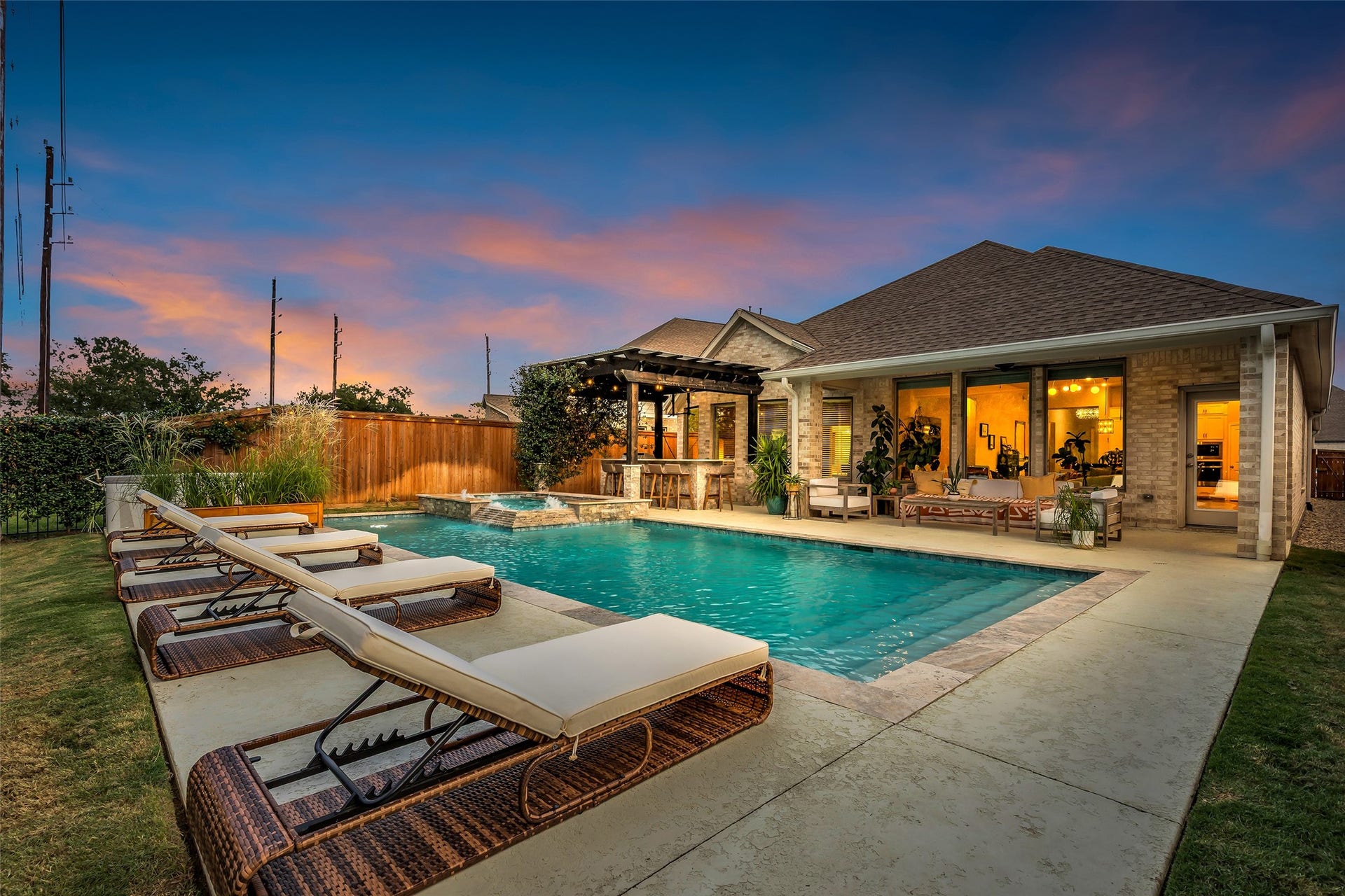 A spectacular backyard retreat featuring a sparkling pool, spa and inviting outdoor spaces designed for relaxing and entertaining.