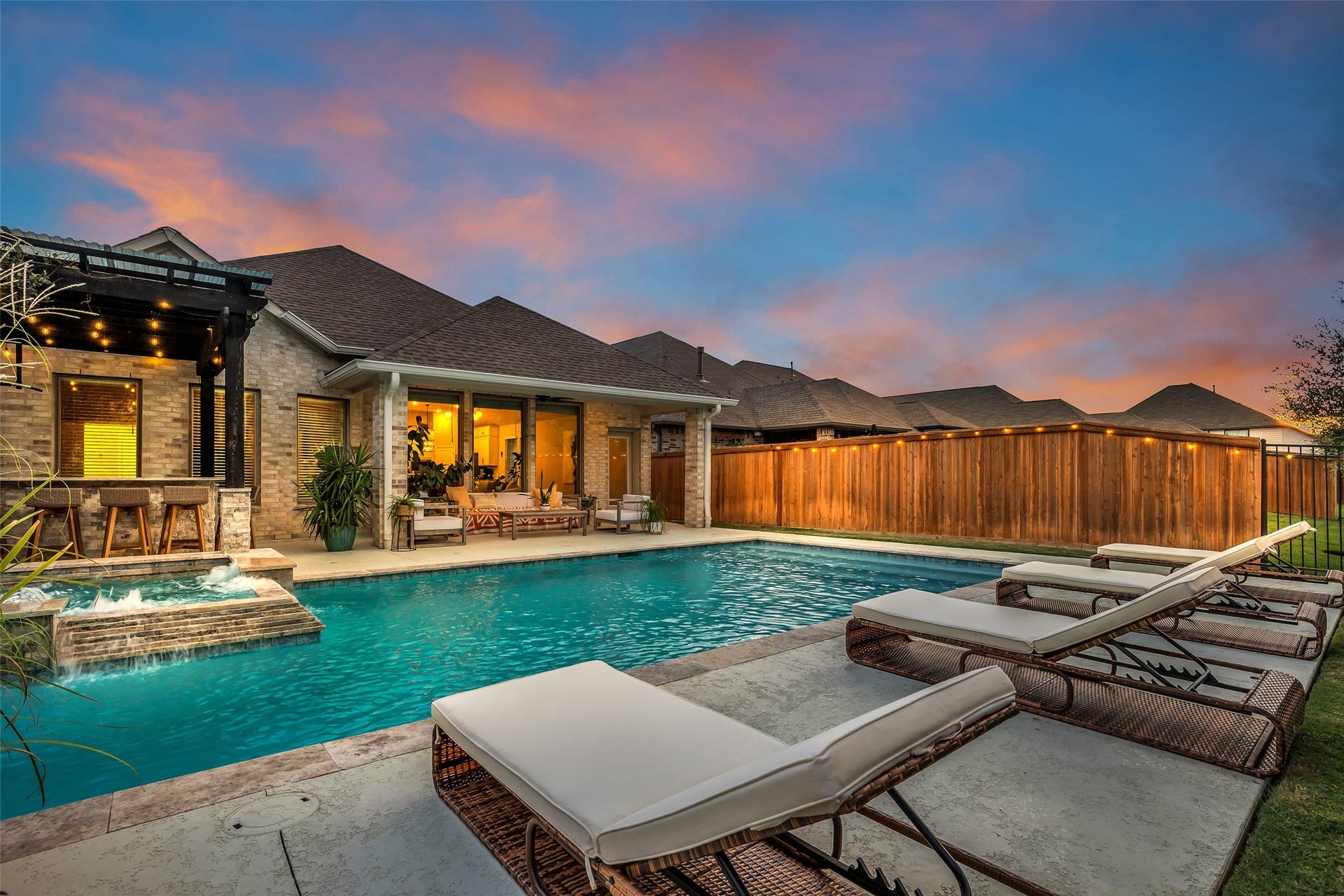 Spacious decking surrounds the pool, with plenty of room for loungers and guests.