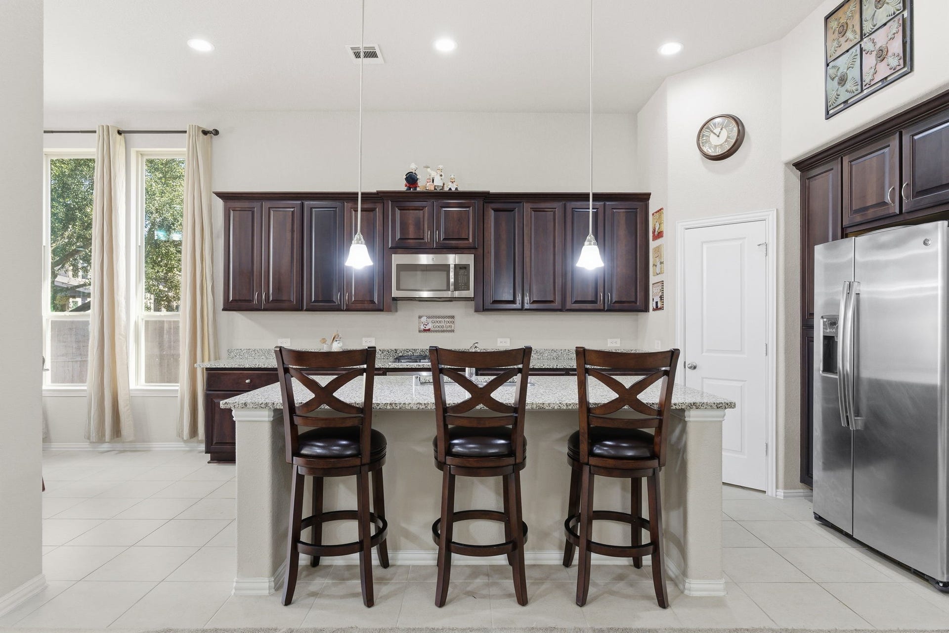 Beautiful kitchen features granite counter tops and massive kitchen island perfect for family gatherings!