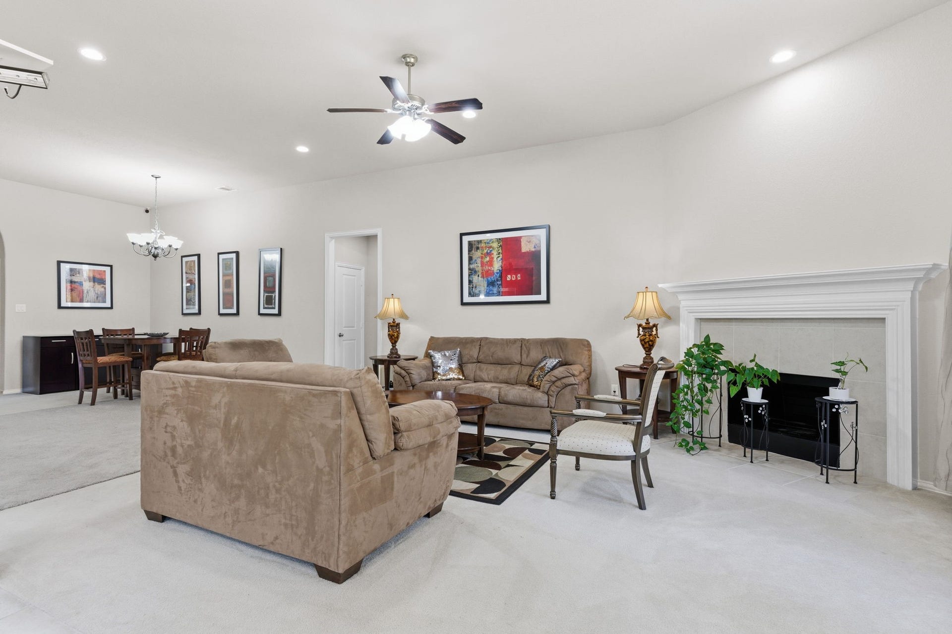 Cozy fireplace keeps your common area warm on those cold movie nights.