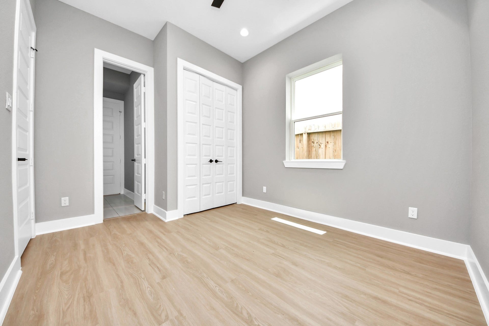 This bright secondary bedroom offers comfortable dimensions and an easy-to-furnish layout.
