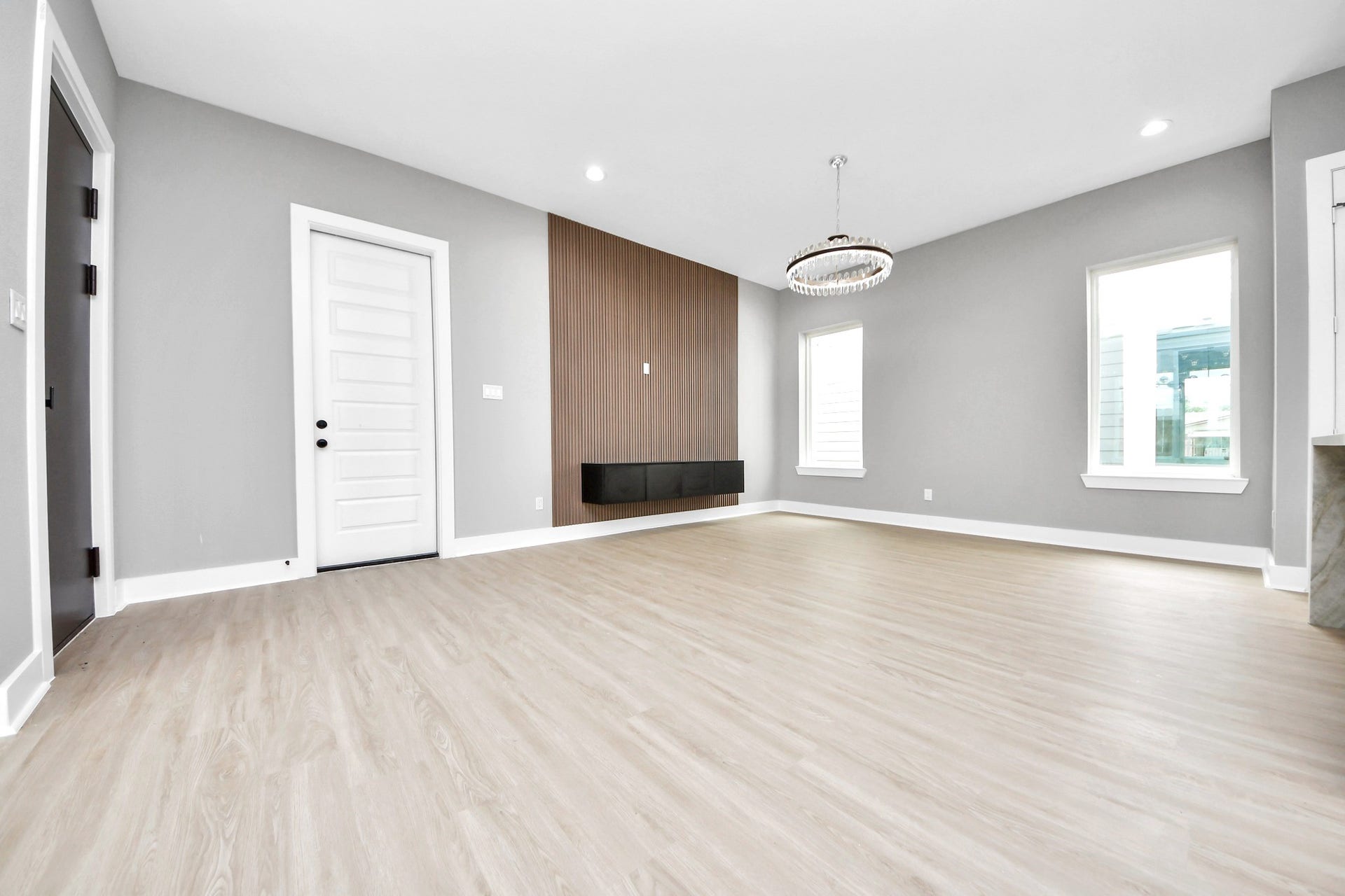 The vacant view highlights Unit Ds true proportions, statement lighting, feature wall and bright open layout.