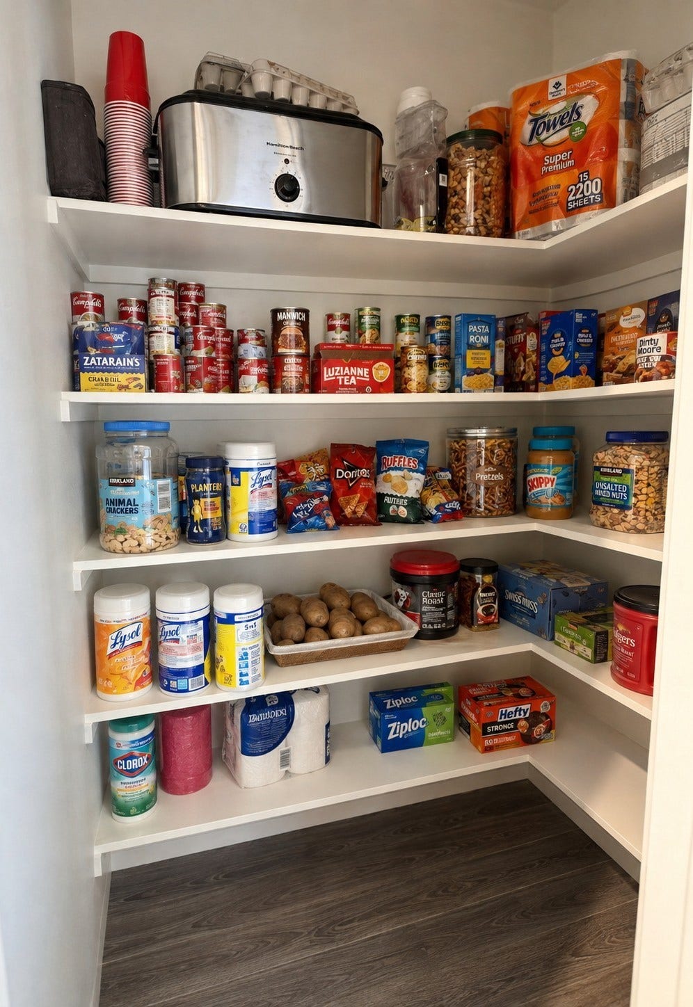 4933 1/2 Powers Ln, Alvin, TX 77511 Spacious pantry with wraparound shelving provides abundant storage.