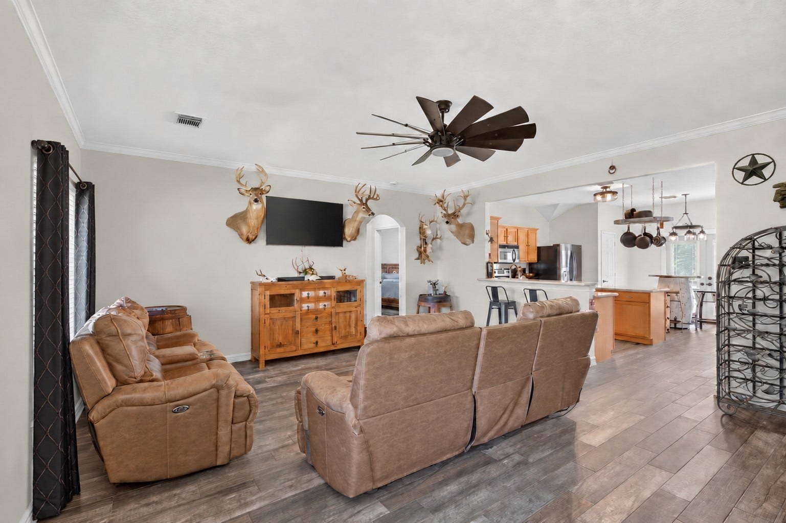4933 1/2 Powers Ln, Alvin, TX 77511 Spacious living room with an open layout and tile flooring extending throughout the main areas of the home.