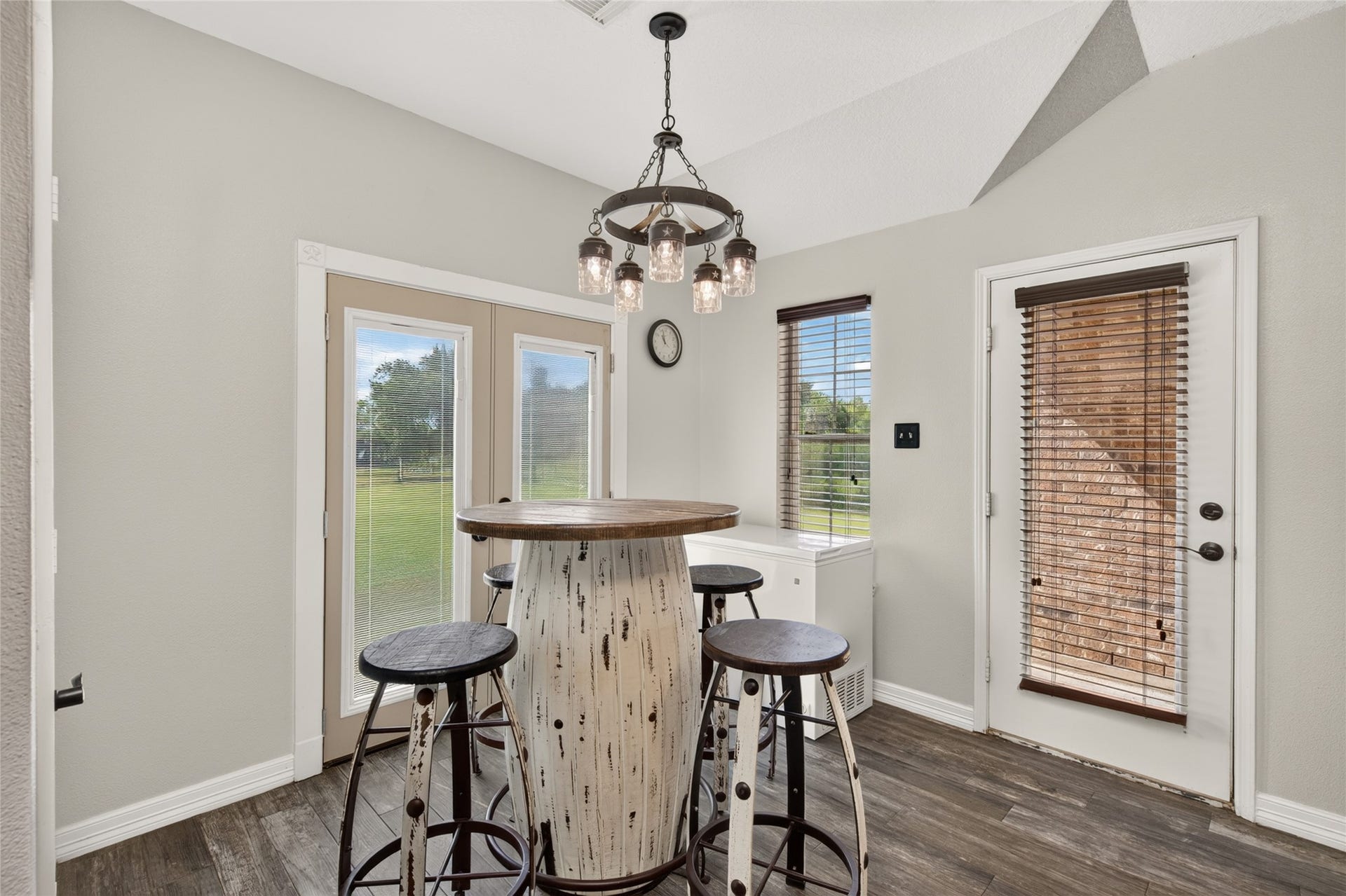 4933 1/2 Powers Ln, Alvin, TX 77511 Charming breakfast area with French doors to the backyard views and a second door leading to a patio.
