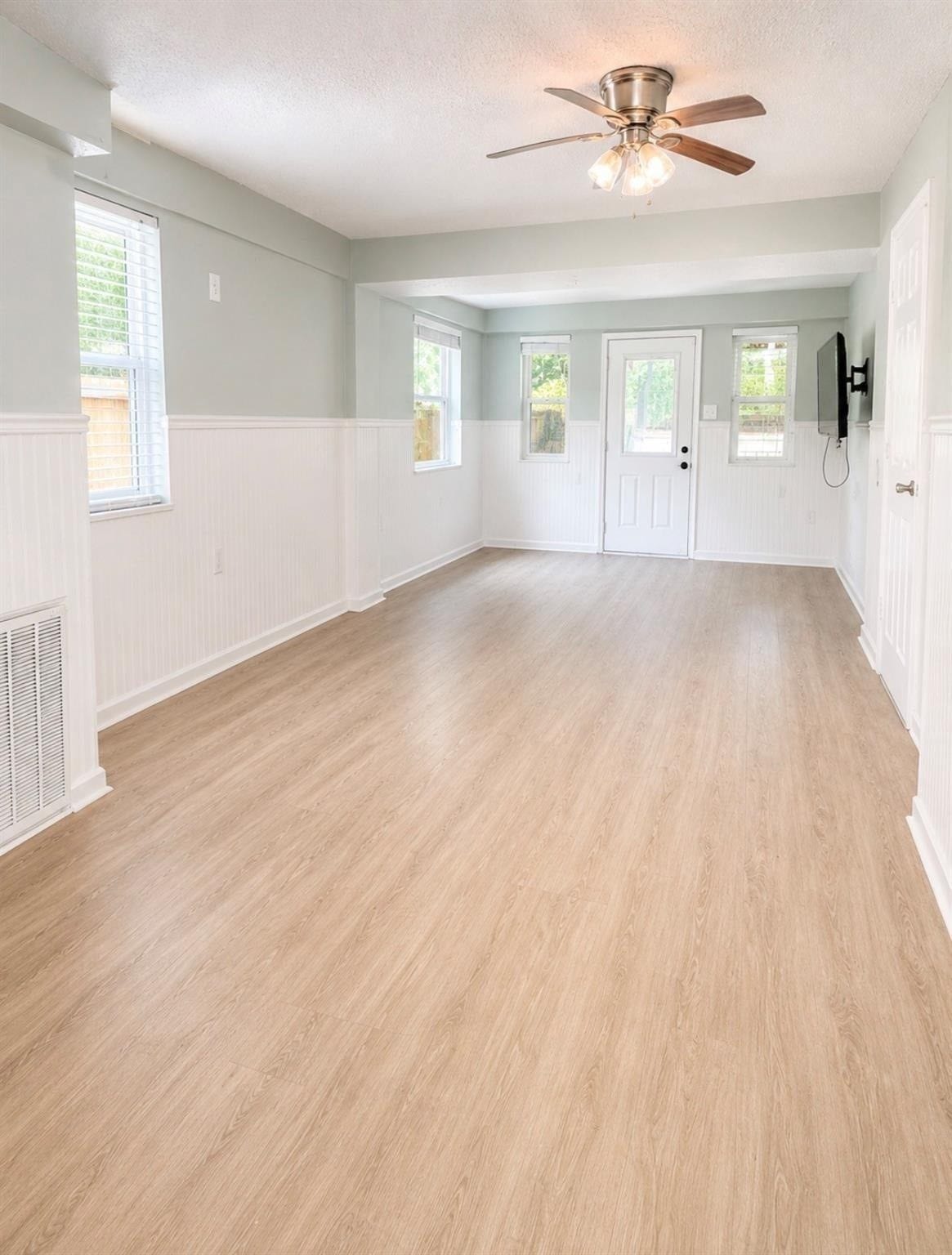 4509 Country Club Drive, Dickinson, TX 77539 3rd bedroom downstairs with door that leads to back deck. This room has a full bathroom.