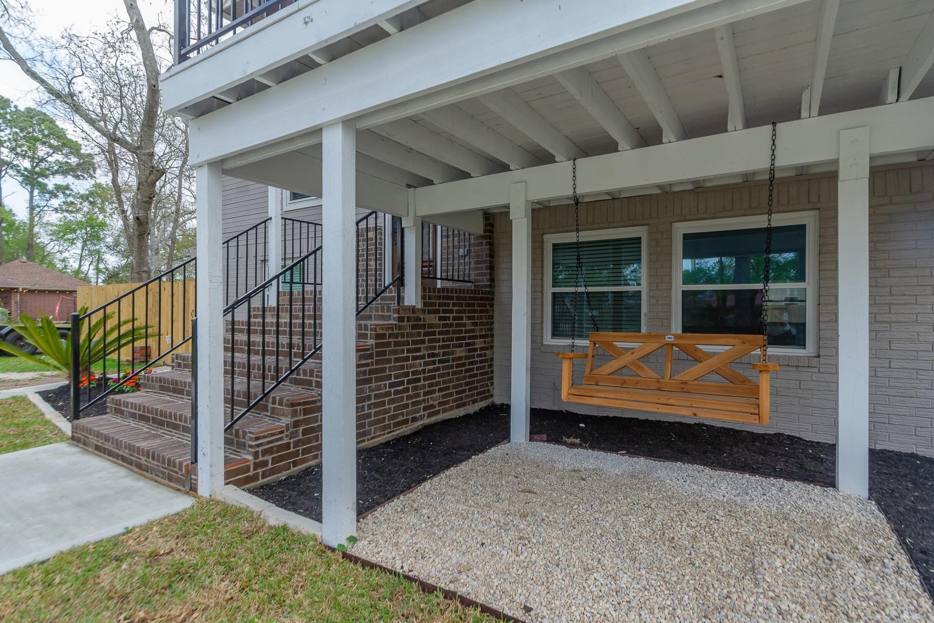 4509 Country Club Drive, Dickinson, TX 77539 A shaded, covered area with a porch swing, tucked neatly under the deck.