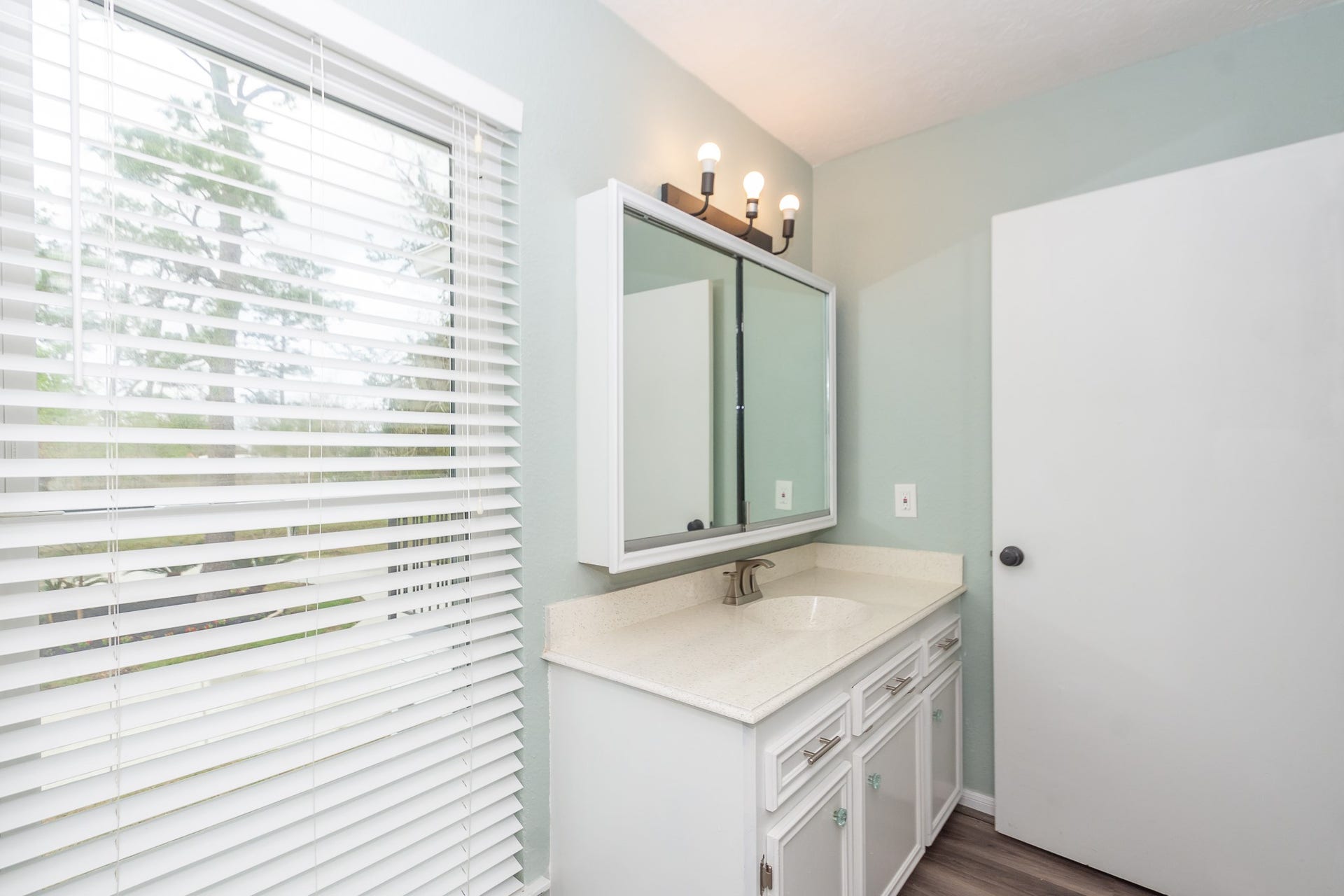 4509 Country Club Drive, Dickinson, TX 77539 2nd view of Upstairs secondary bathroom with a full-size window overlooking the front of the home; a rare find that fills the space with natural light.