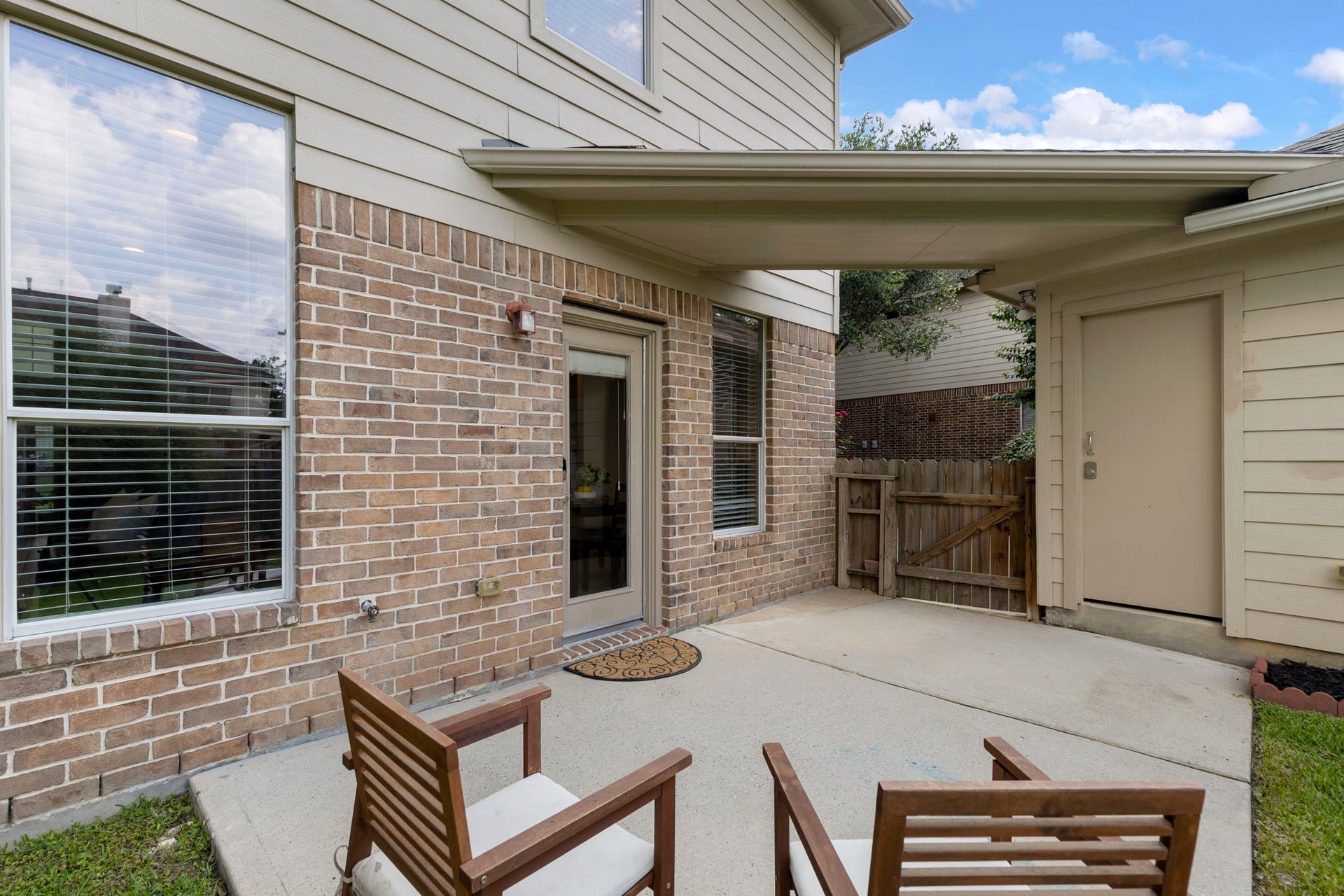 14 N Bardsbrook Circle, The Woodlands, TX 77382 The patio offers the perfect space to enjoy your morning coffee, unwind in the evenings, or gather with friends while overlooking the backyard.