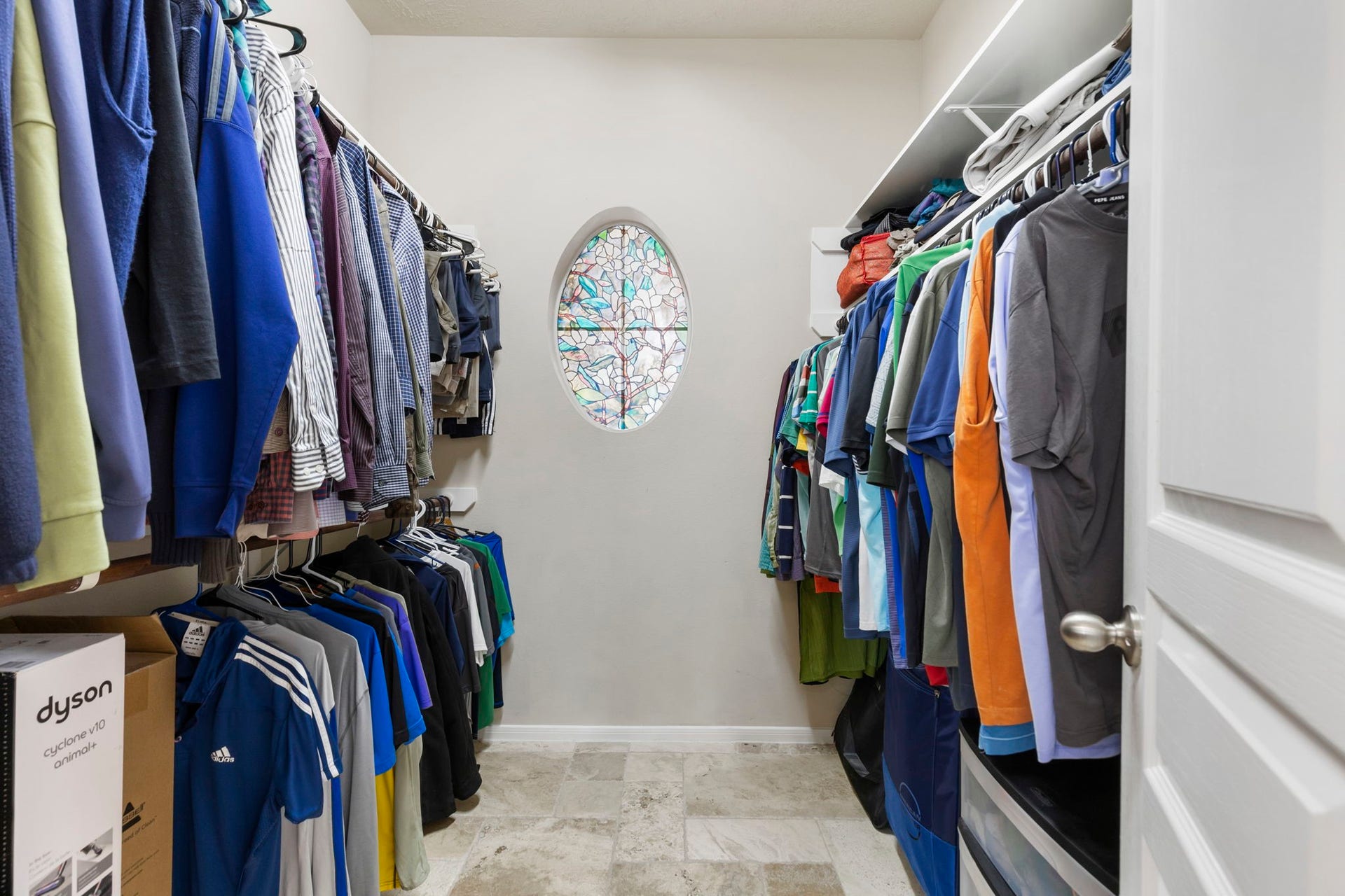 14 N Bardsbrook Circle, The Woodlands, TX 77382 Generously sized walk-in closet with built-in shelving and plenty of storage space.