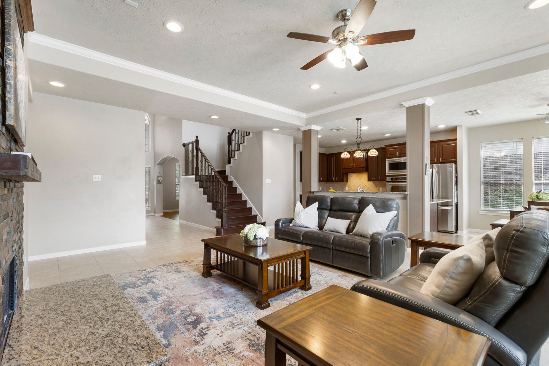 14 N Bardsbrook Circle, The Woodlands, TX 77382 The open-concept layout creates a seamless connection between the living room and kitchen, making everyday living and entertaining effortless.