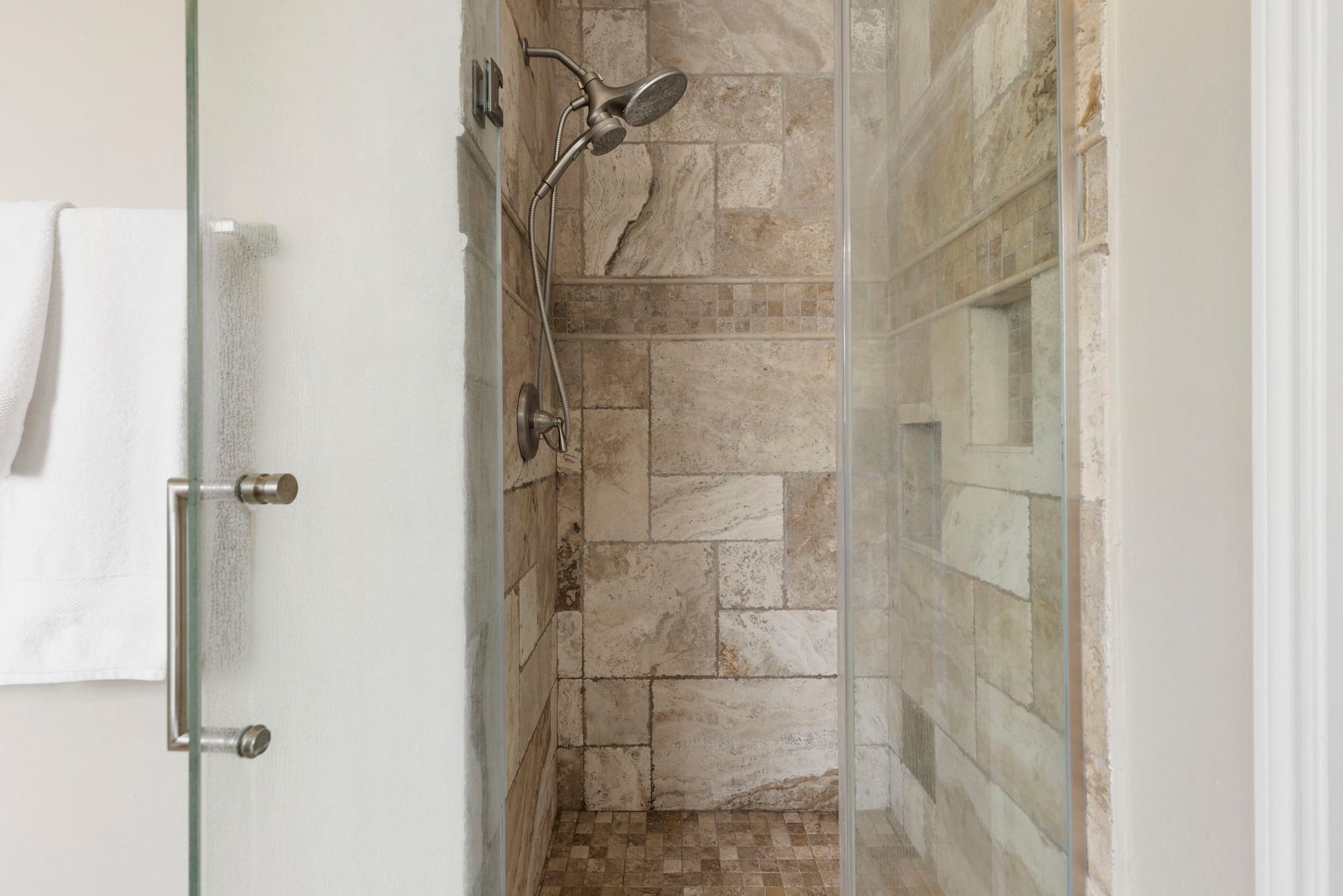 14 N Bardsbrook Circle, The Woodlands, TX 77382 Updated walk-in shower featuring frameless glass, tile surround, and a clean, timeless design.
