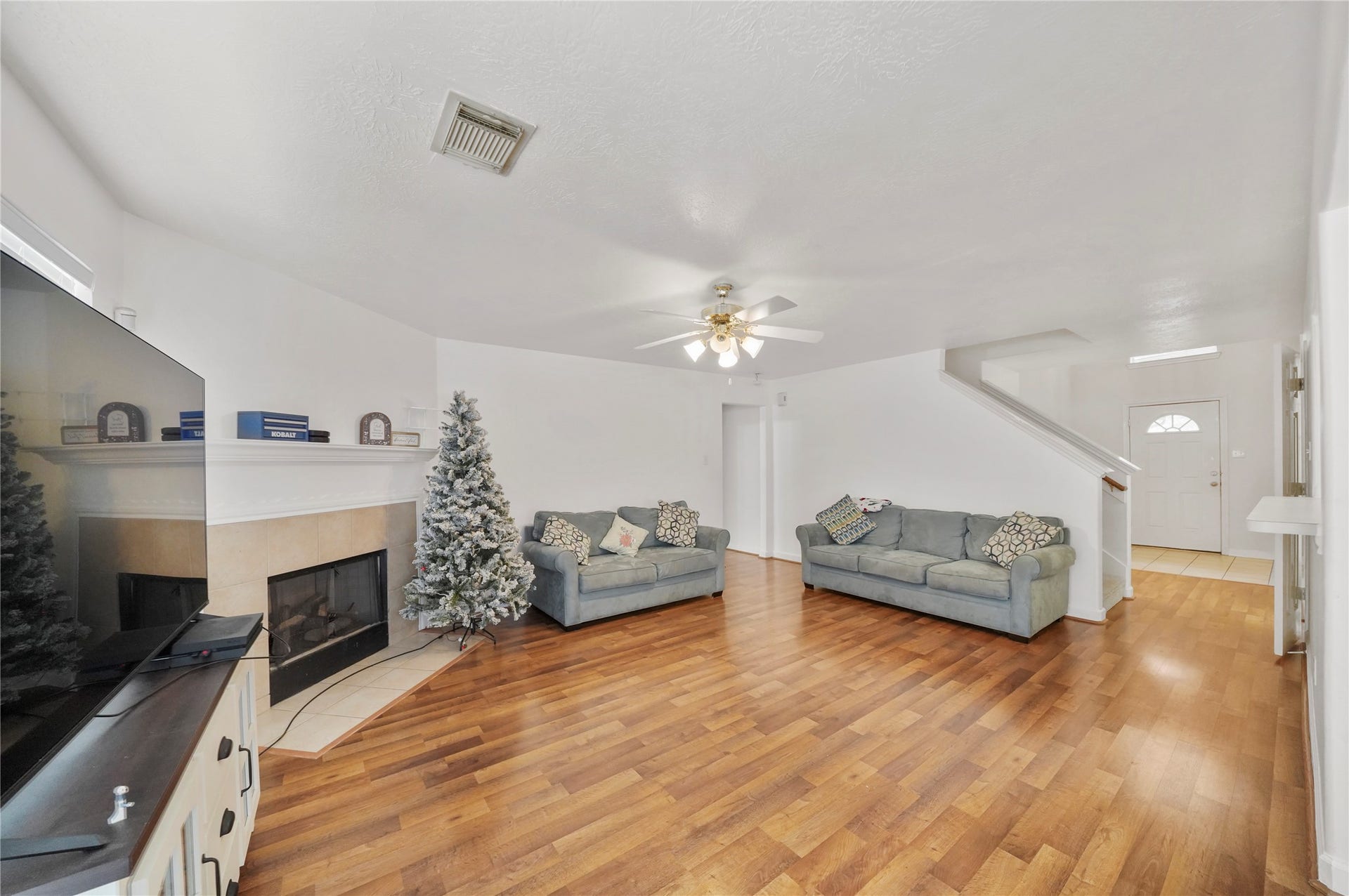 5614 Gaffney Lane, Houston, TX 77084 The gas fireplace creates a welcoming focal point in the family room, ready to anchor relaxed evenings and casual gatherings.