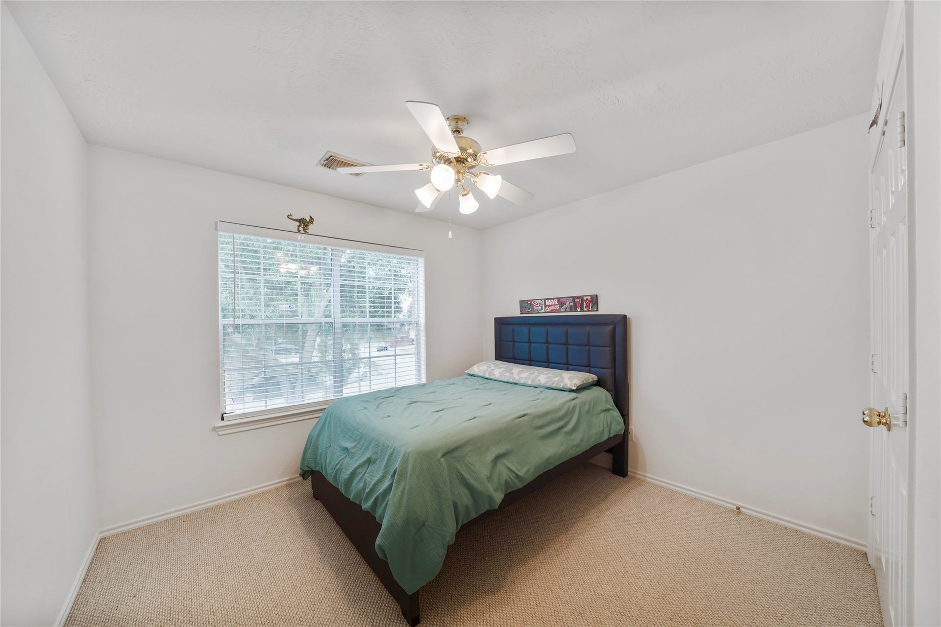 5614 Gaffney Lane, Houston, TX 77084 With a ceiling fan, natural light, and room to personalize, this third secondary bedroom rounds out the upstairs sleeping spaces.